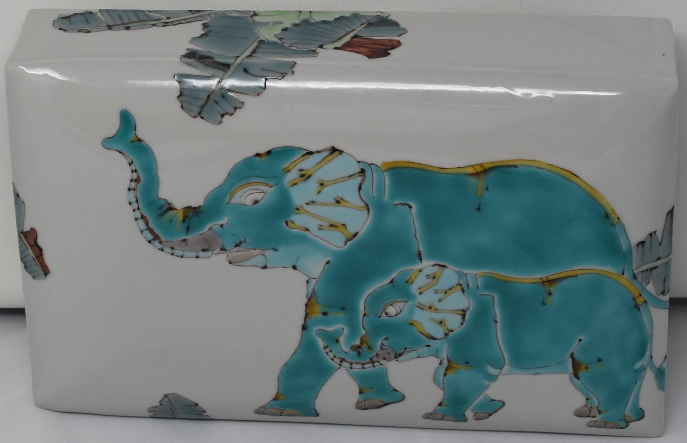 Exquisite unique contemporary Japanese signed decorative ceramic box, hand painted in green with a unique interpretation of elephants. The highly acclaimed artist has drawn on various animals featured in Buddhist scriptures and religious practice to