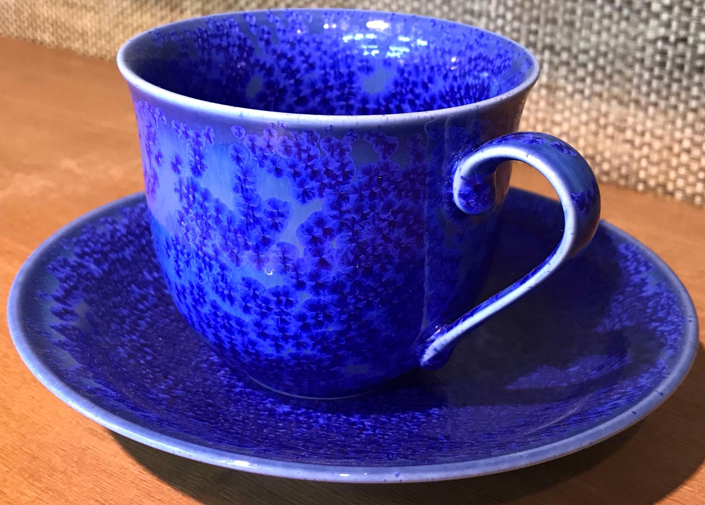 Exceptional Japanese contemporary porcelain cup and saucer, hand-glazed in a stunning vivid royal blue on a beautifully shaped body. This is a signed work by a highly acclaimed award-winning master porcelain artist from the Imari-Arita region of