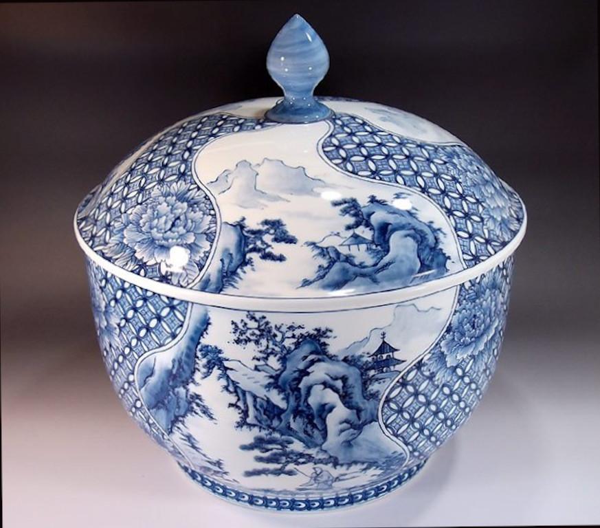 Exquisite contemporary Japanese large three-piece porcelain box, intricately hand-painted in cobalt blue underglaze on an elegantly shaped body, a signed masterpiece by highly acclaimed master porcelain artist from the historic Imari-Arita region of