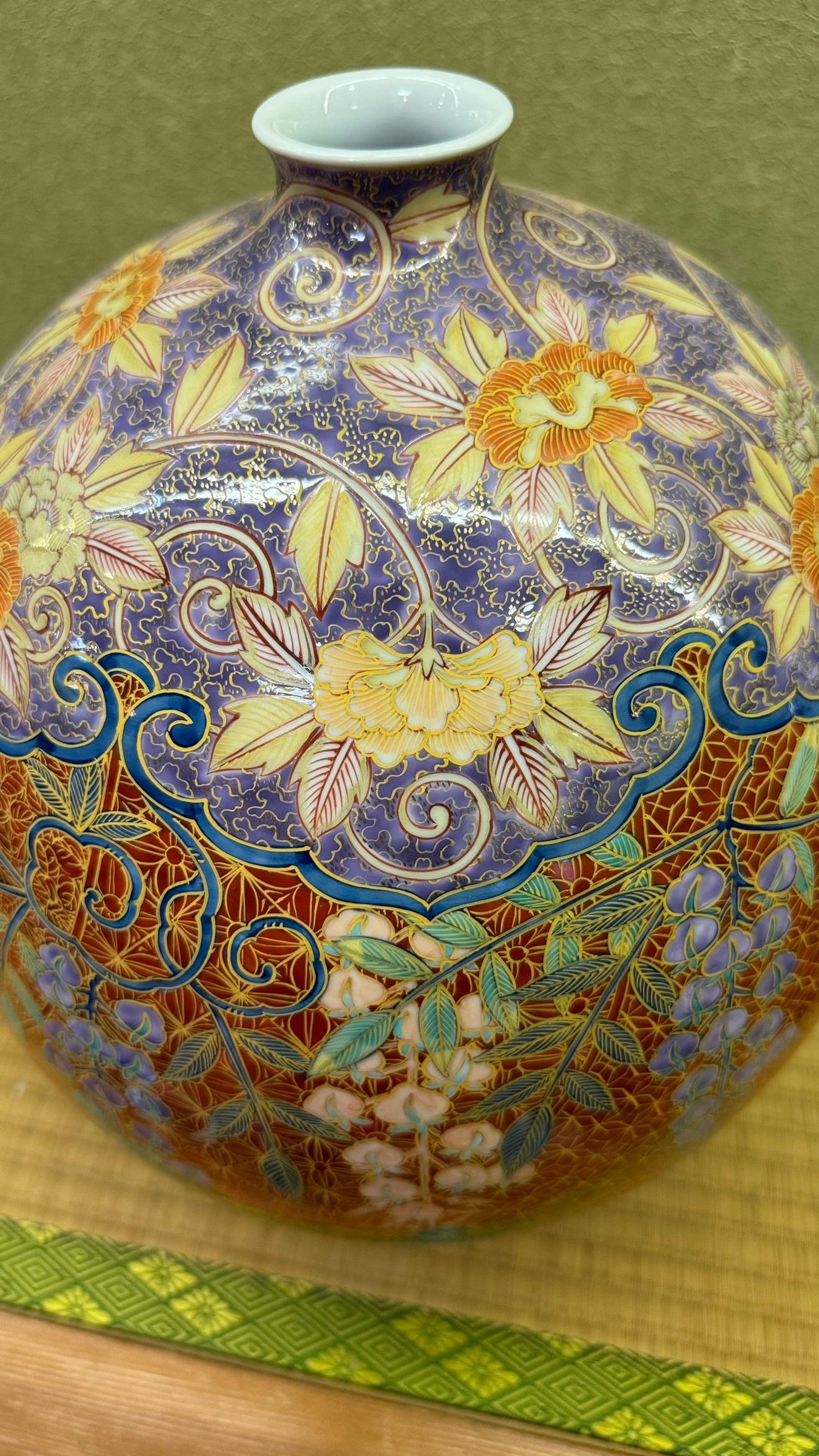 Extraordinary Japanese contemporary museum-quality decorative porcelain vase, extremely intricately hand-painted in dark brick orange, purple, green and yellow on a beautifully shaped porcelain body, a signed masterpiece by highly acclaimed master