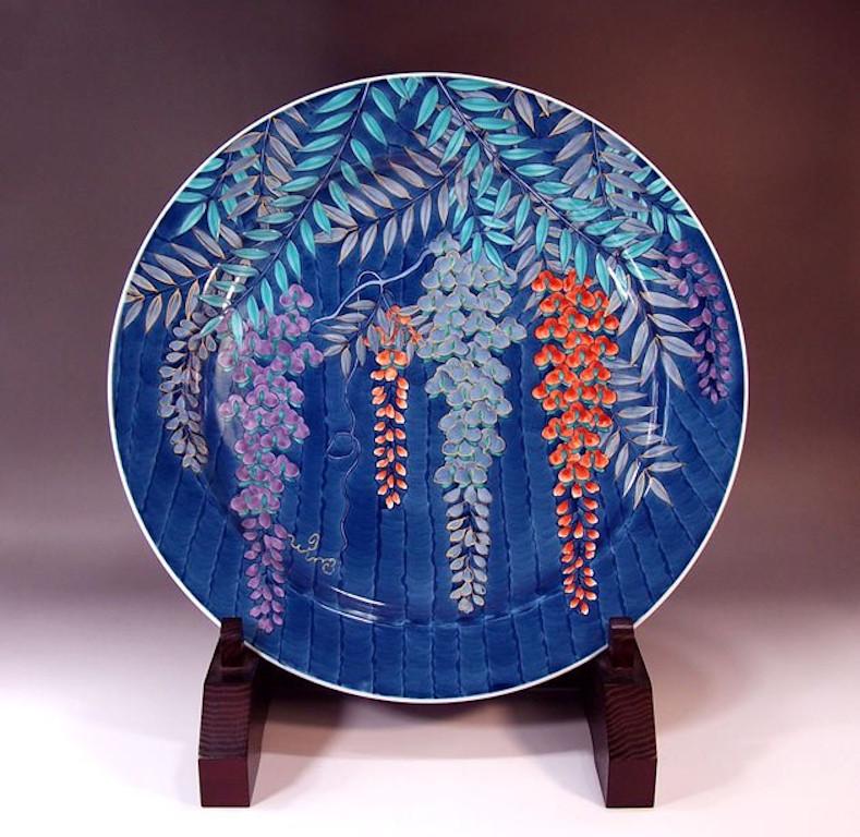 Exquisite contemporary Japanese porcelain decorative charger, intricately hand painted in gold, pink and blue, a signed piece by a master porcelain artist in the Imari-Arita tradition. In 2016, the British Museum added a work by this artist to its