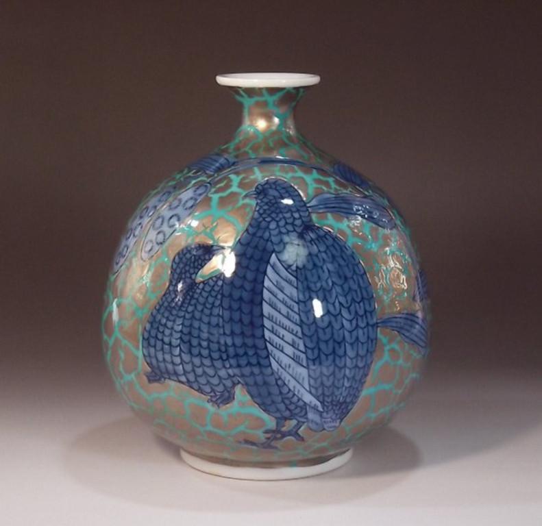 Contemporary Japanese decorative porcelain vase, hand painted in blue underglaze and platinum gilted, a work by widely acclaimed master porcelain artist in traditional patterns of the Imari-Arita region of Japan and the recipient of numerous