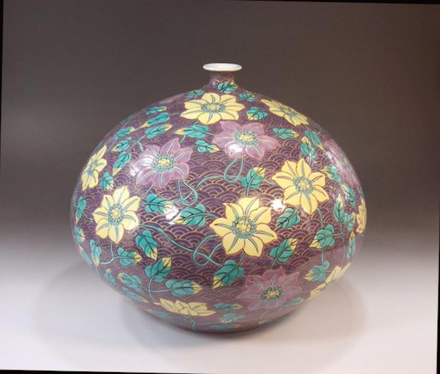 Exquisite Japanese contemporary porcelain vase, an exceptional piece, intricately hand painted in yellow, purple and green, and signed by widely acclaimed master porcelain artist of Japan’s Imari-Arita region. The artist is the recipient of numerous