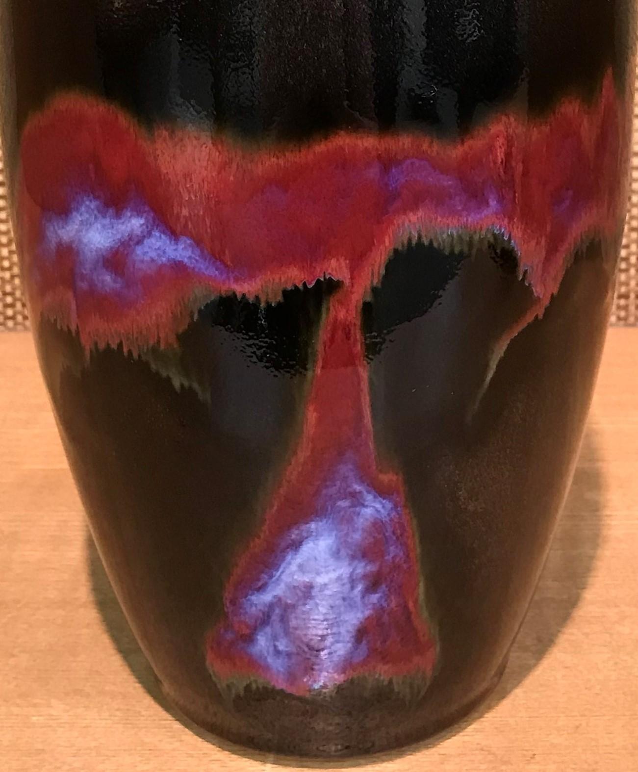 Unique Japanese contemporary hand-glazed elegant decorative porcelain vase in ruby red, purple and black, a signed work of a highly respected master porcelain artist known for his signature green, purple, ruby red and turquoise colors. He is