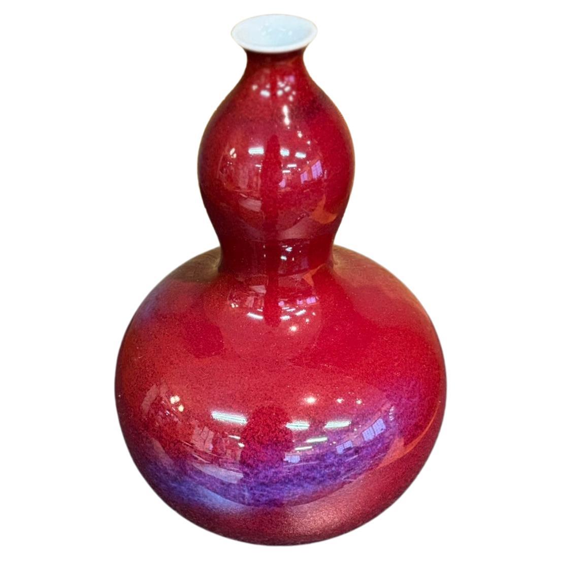 Exceptional Japanese contemporary decorative porcelain vase, hand-glazed in vivid red and blue/purple on a stunning gourd-shaped body, from the extraordinary signature Galaxy series by highly celebrated award-winning master porcelain artist of the