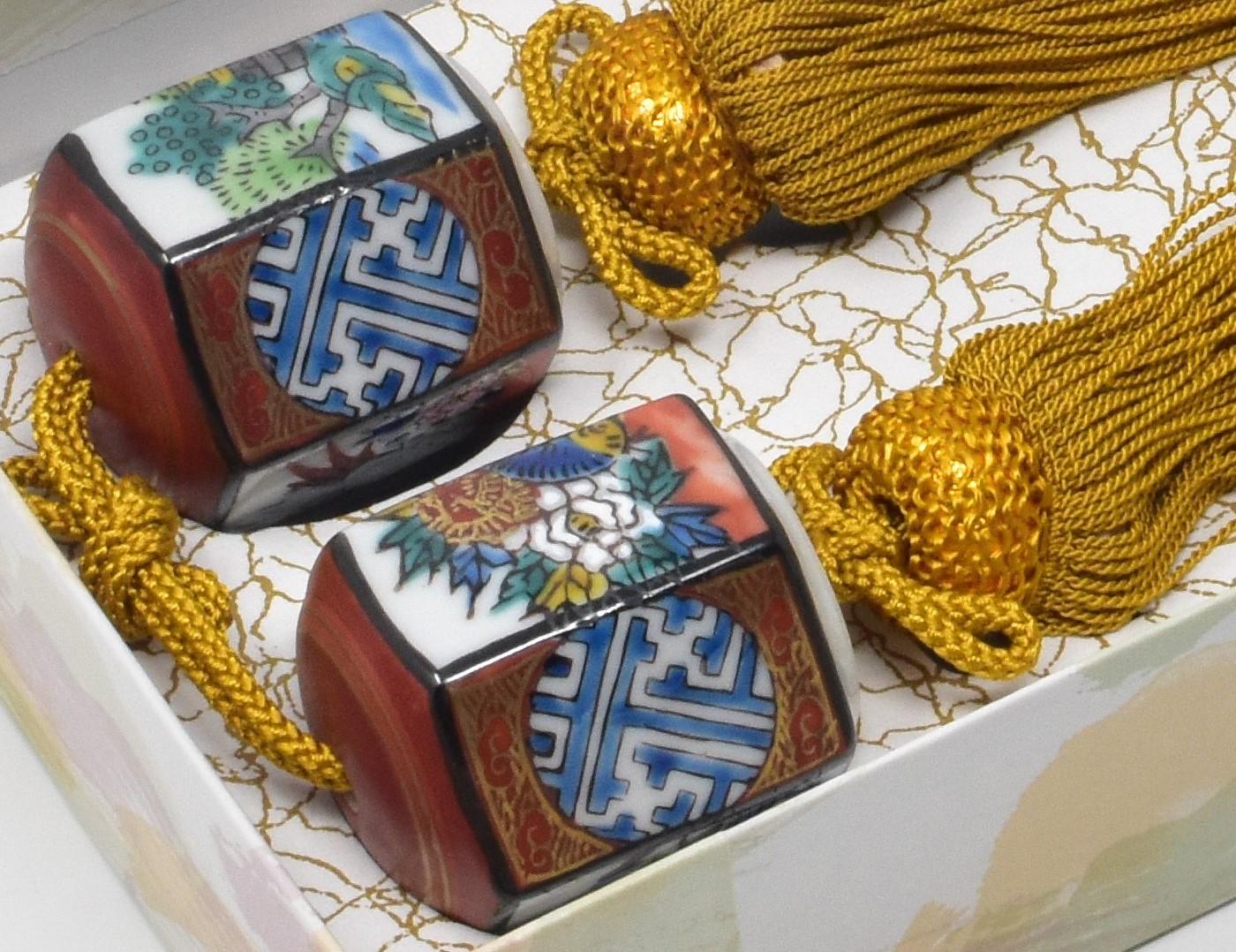 Pair of porcelain scroll weights (fuchin), intricately hand painted on a beautiful hexagonal shaped body in red, blue and green, from the Kutani region of Japan. Each piece bears the mark of Kutani on the bottom.
Traditional Japanese rooms are often