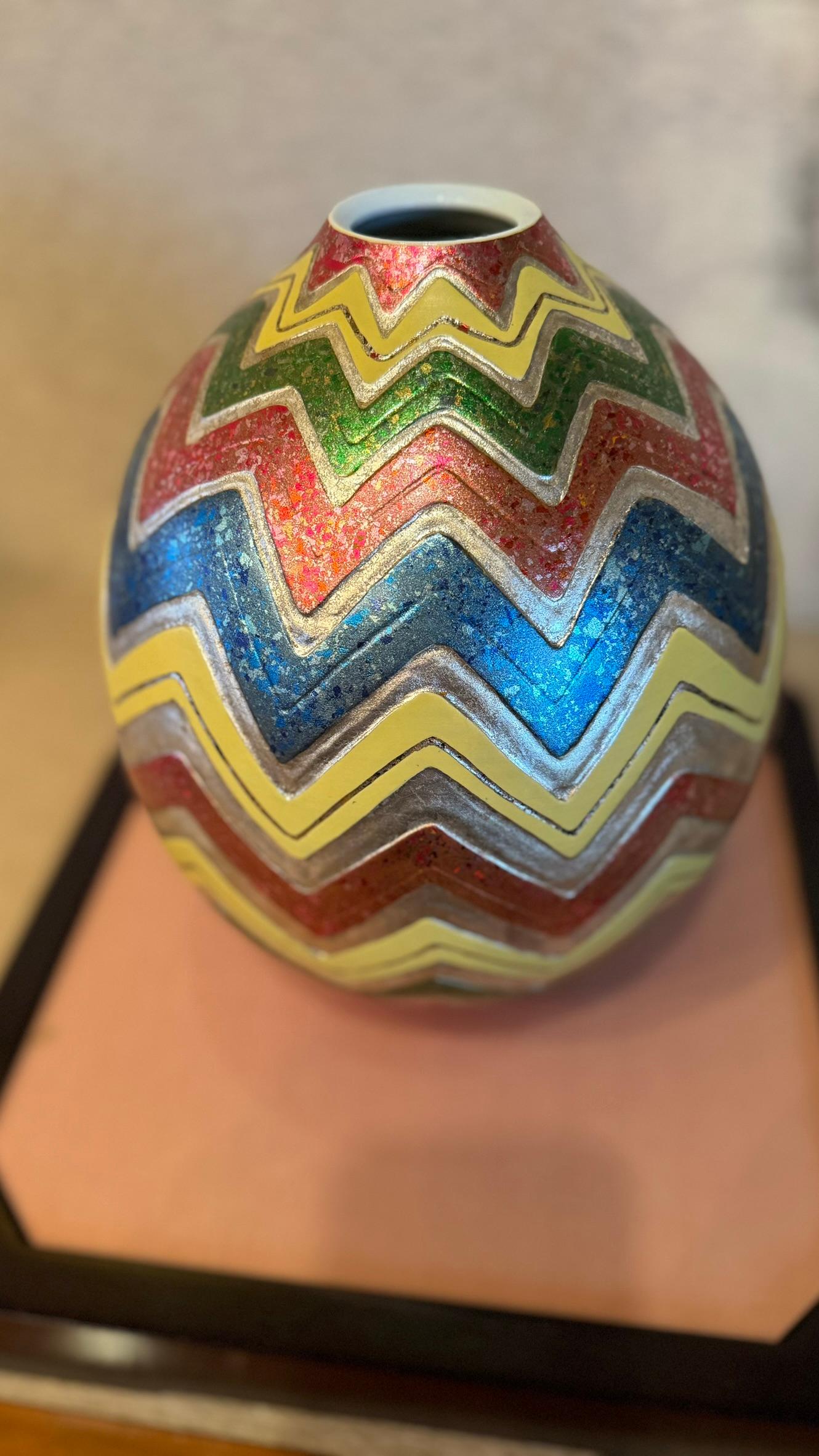 Extraordinary Japanese contemporary museum-quality decorative porcelain vase in a stunning wave pattern with intricate etchings features platinum foils plus silver foil tinted in shades of vivid green, blue, red and yellow, meticulously positioned
