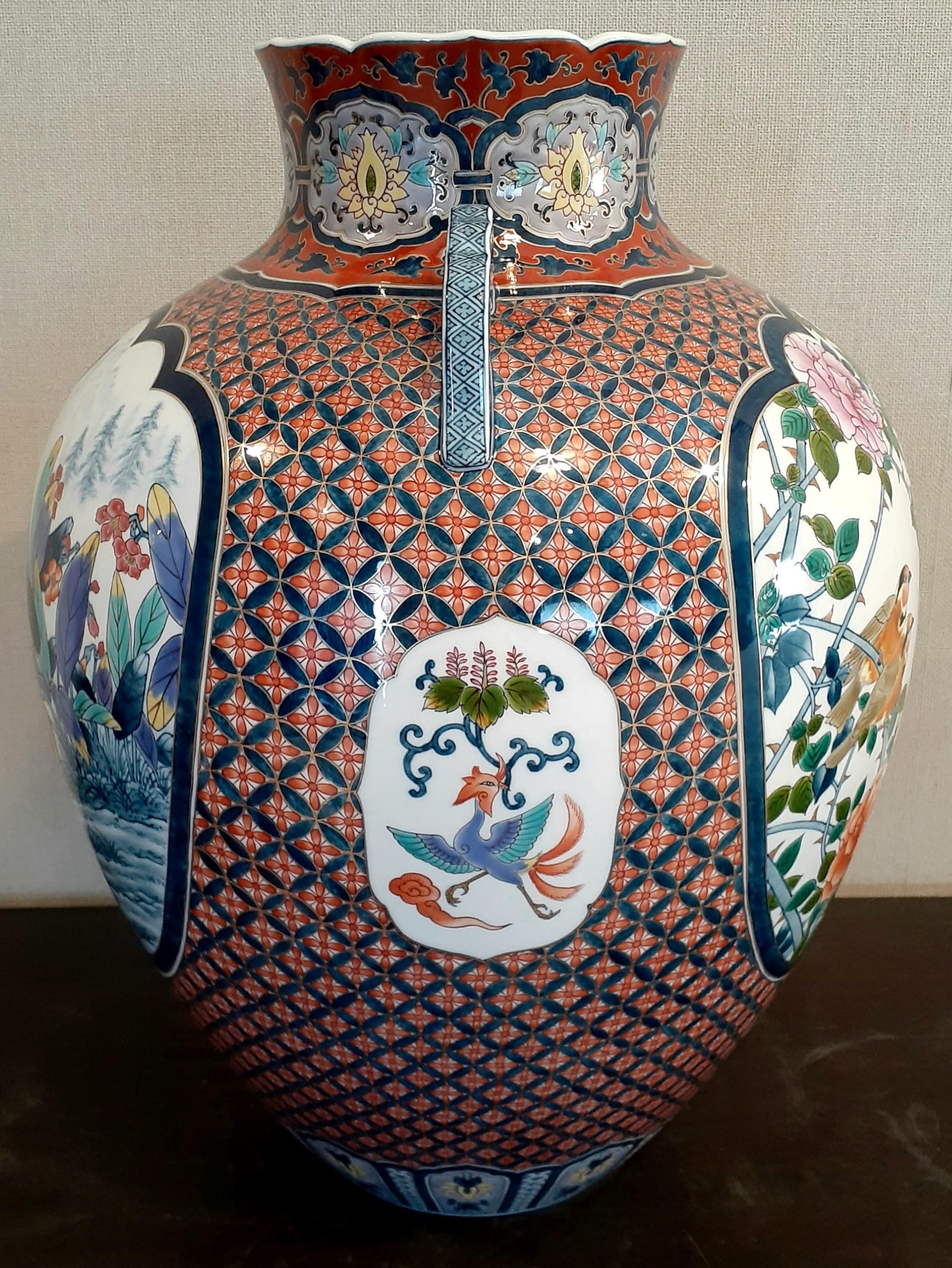 Unique very large highly collectable contemporary Japanese gilded Ko-Imari (Old Imari) decorative porcelain vase, intricately hand painted in blue, red, green, yellow and orange, on a stunningly shaped body with two graceful handles, a magnificent