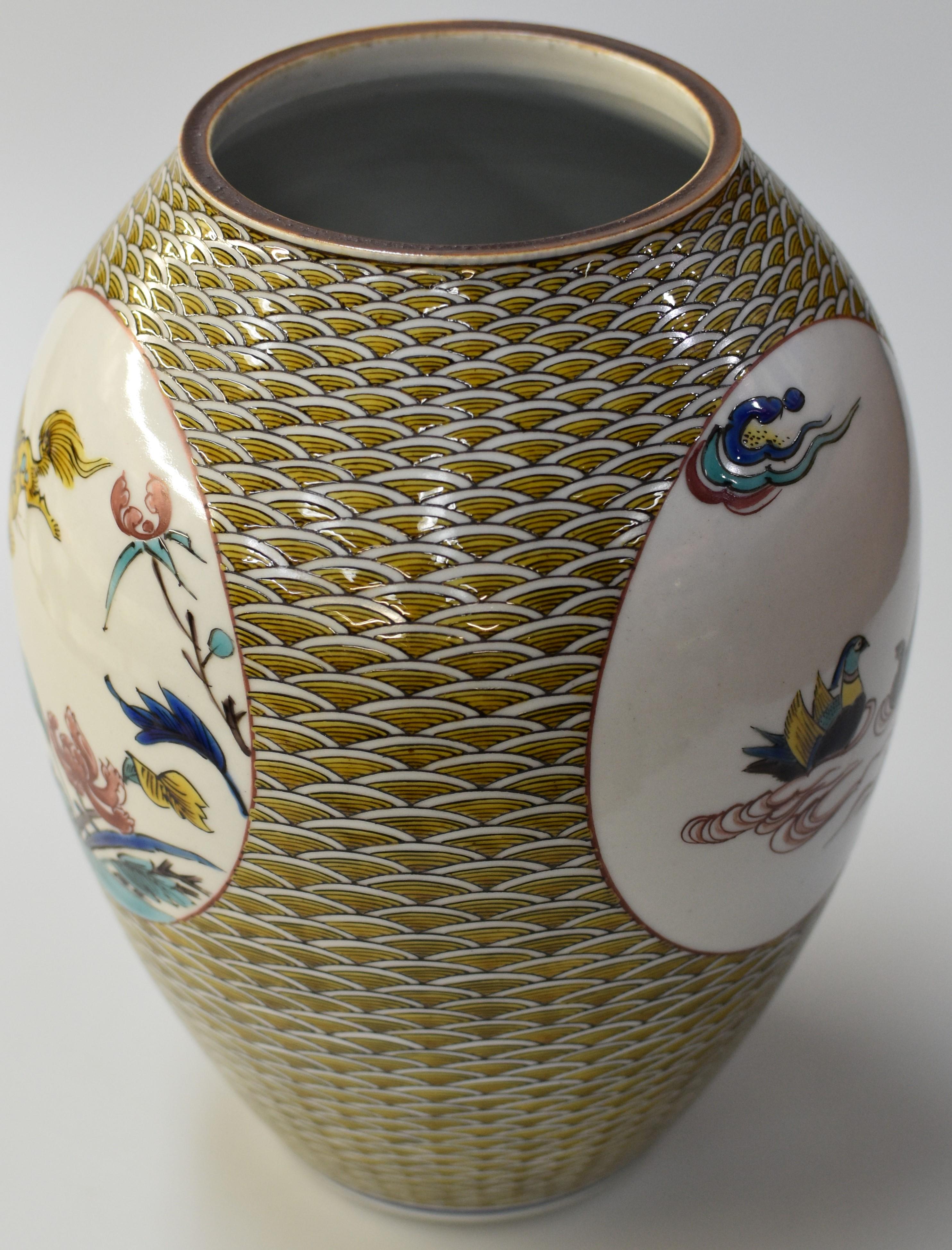 Exquisite Japanese contemporary museum quality signed Kutani porcelain vase, intricately hand painted in Ko-Kuatani (old Kutani) traditional five colors of mustard yellow, purple, green, blue and red. It is a masterpiece by master porcelain artist