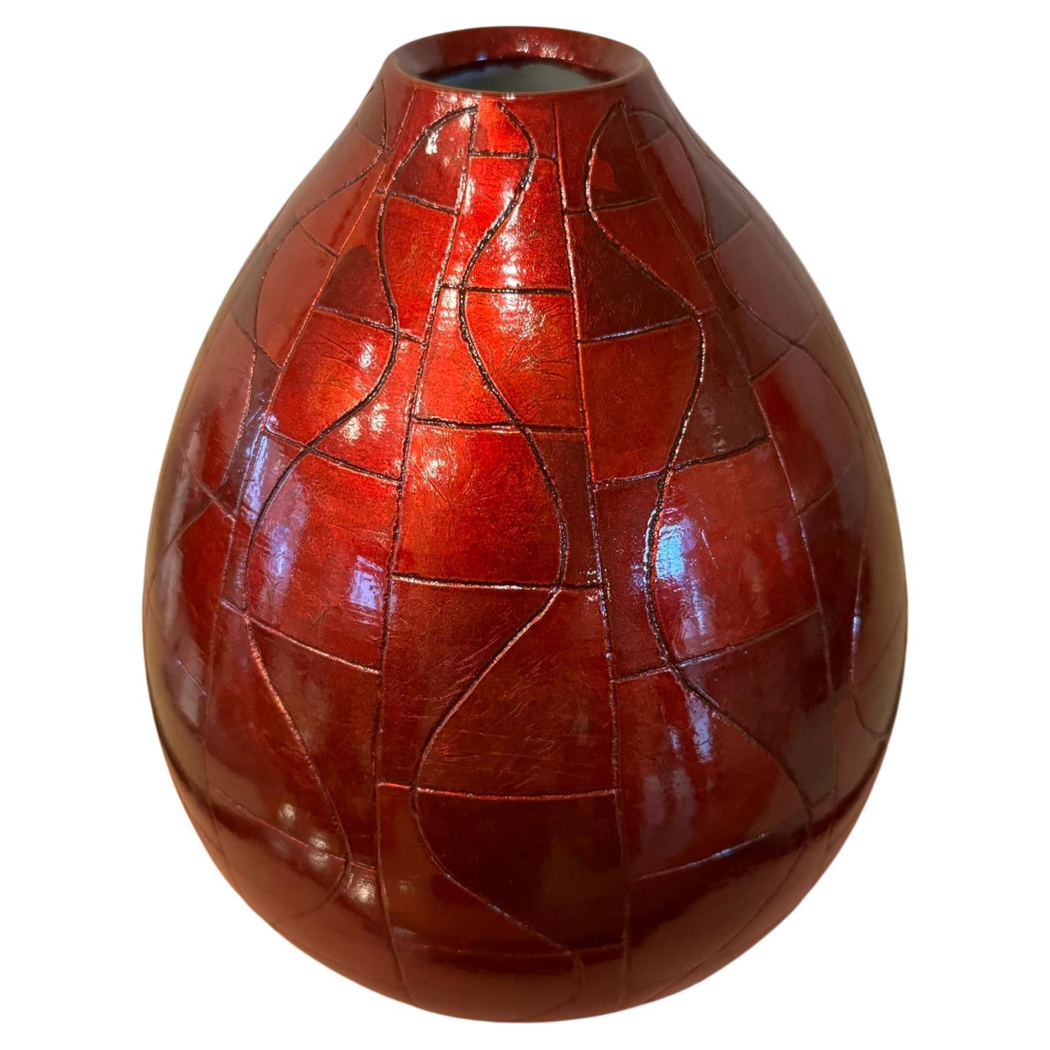 Exquisite Japanese contemporary museum quality decorative porcelain vase in a stunning shape featuring high purity silver leafs tinted in four beautiful shades of red meticulously positioned to create a patchwork motif using lacquer as an adhesive
