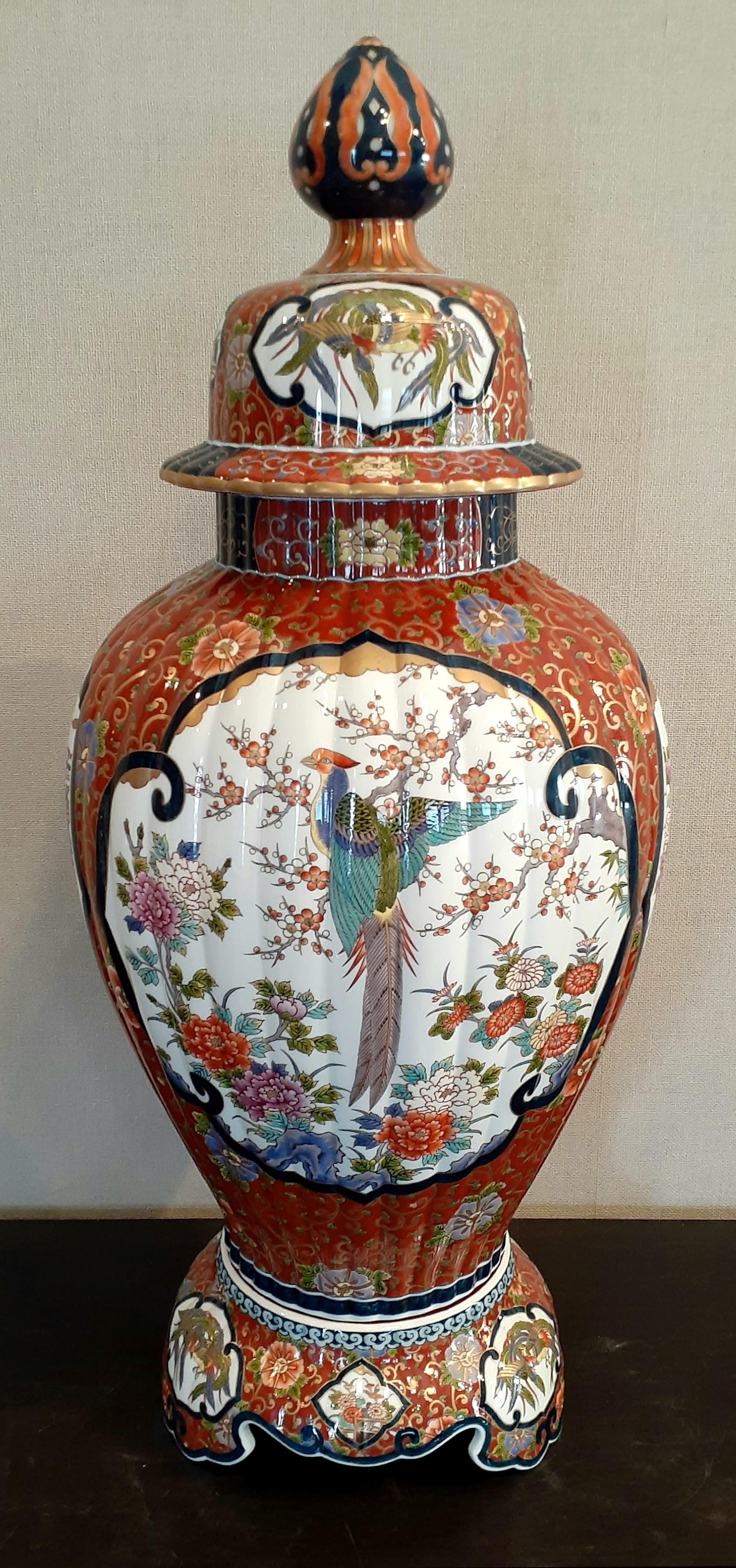 Extraordinary very large highly collectable contemporary Japanese gilded Ko-Imari (Old Imari) three-piece lidded porcelain vase/jar, exquisitely intricately hand painted in blue underglaze and polychrome overglaze enameling in red, green and orange,