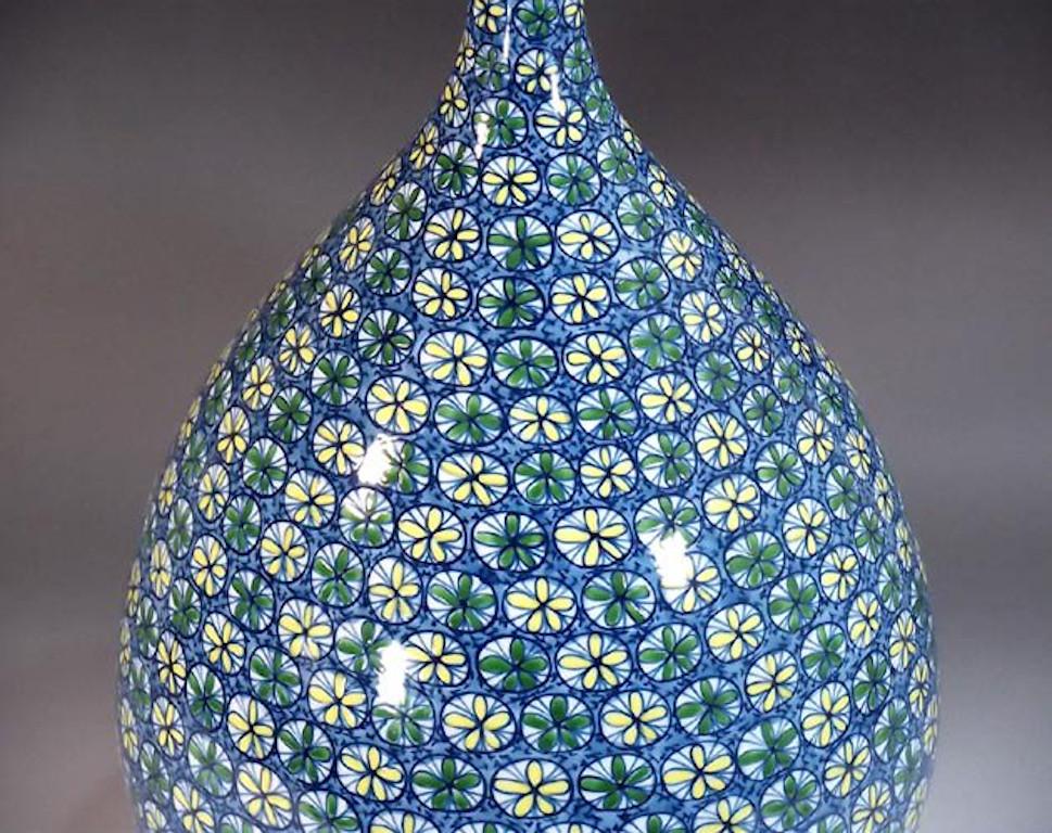 Exquisite Japanese Contemporary decorative porcelain vase, extremely intricately hand painted In vivid green, yellow and blue on a stunning bottle shaped body with an elegant long neck, featuring an auspicious 