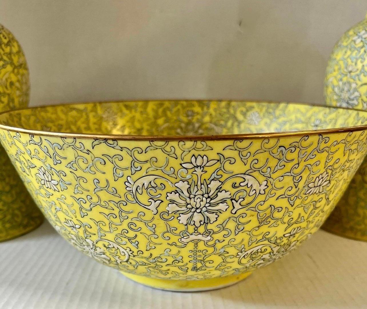 Stunning set of three pieces, two vases and own bowl, all with rare yellow, blue and white color scheme from Japan. Still in very good condition. The dimensions for the vases are below and the bowl has a diameter of 12