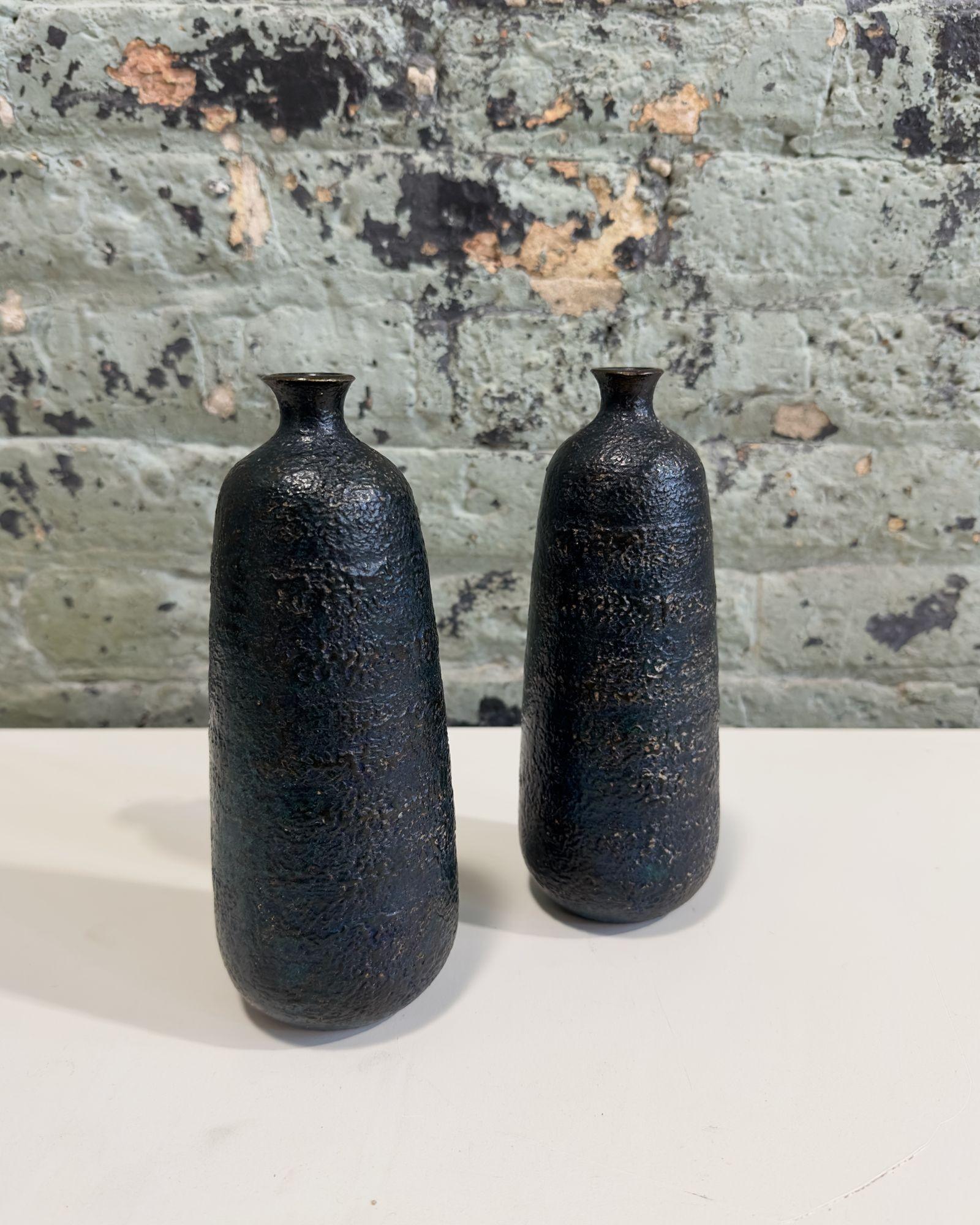 Pair Japanese Craftsman Bronze Vases Black Volcanic Patinated Enamel, Japan 1930's.
Vases have a vibrant color of black with a green/blue hue. Vases are quite heavy being solid bronze. Excellent condition.
Vases measure 9