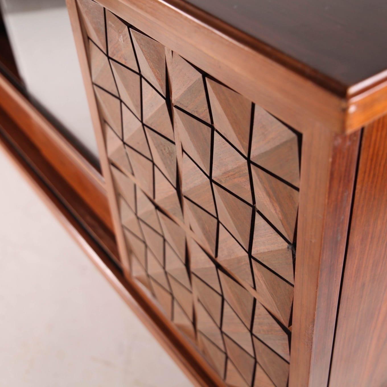 Rare little rosewood Japanese credenza. Very functional with its glass and wood doors, drawers and shelves. 
Unusual dimensions, great quality and condition. 