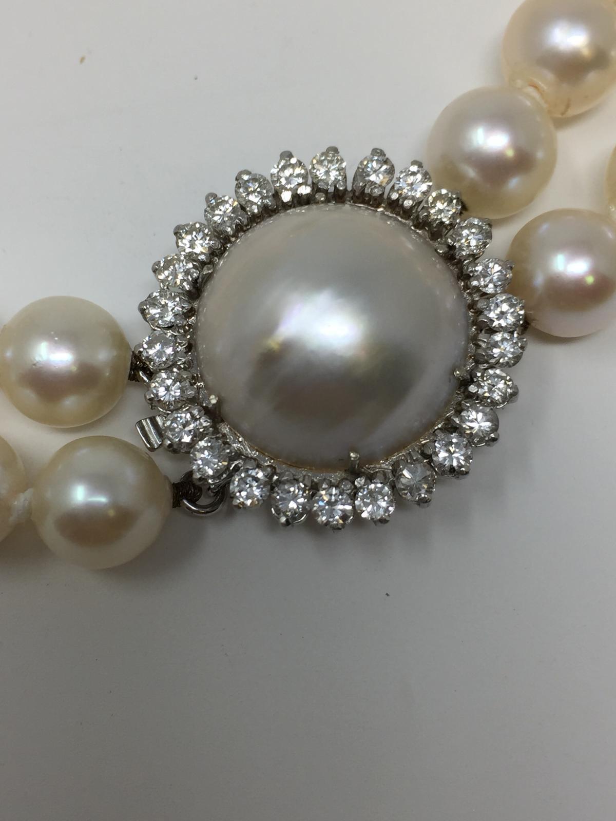 Double strand Japanese Cultured Pearl with creamy high luster appearance.
14kt white gold Diamond and moby pearl clasp. The diamonds are weighing approx. 1.50 ct/tw VS-SI quality in G color. 
Moby pearl is measuring approx. 22mm.