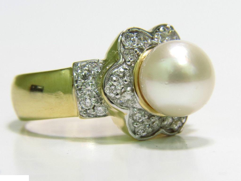 7.5mm Japanese Cultured Pearl

& .75ct, diamonds ring

Pearl is of gorgeous white luster

Diamonds:

G-color, vs-2 clarity

14kt. yellow gold

amazing mounting

8.9 grams

14kt.  yellow gold

ring is 12.4mm wide

depth: 11.7 mm

current size: 7 (can