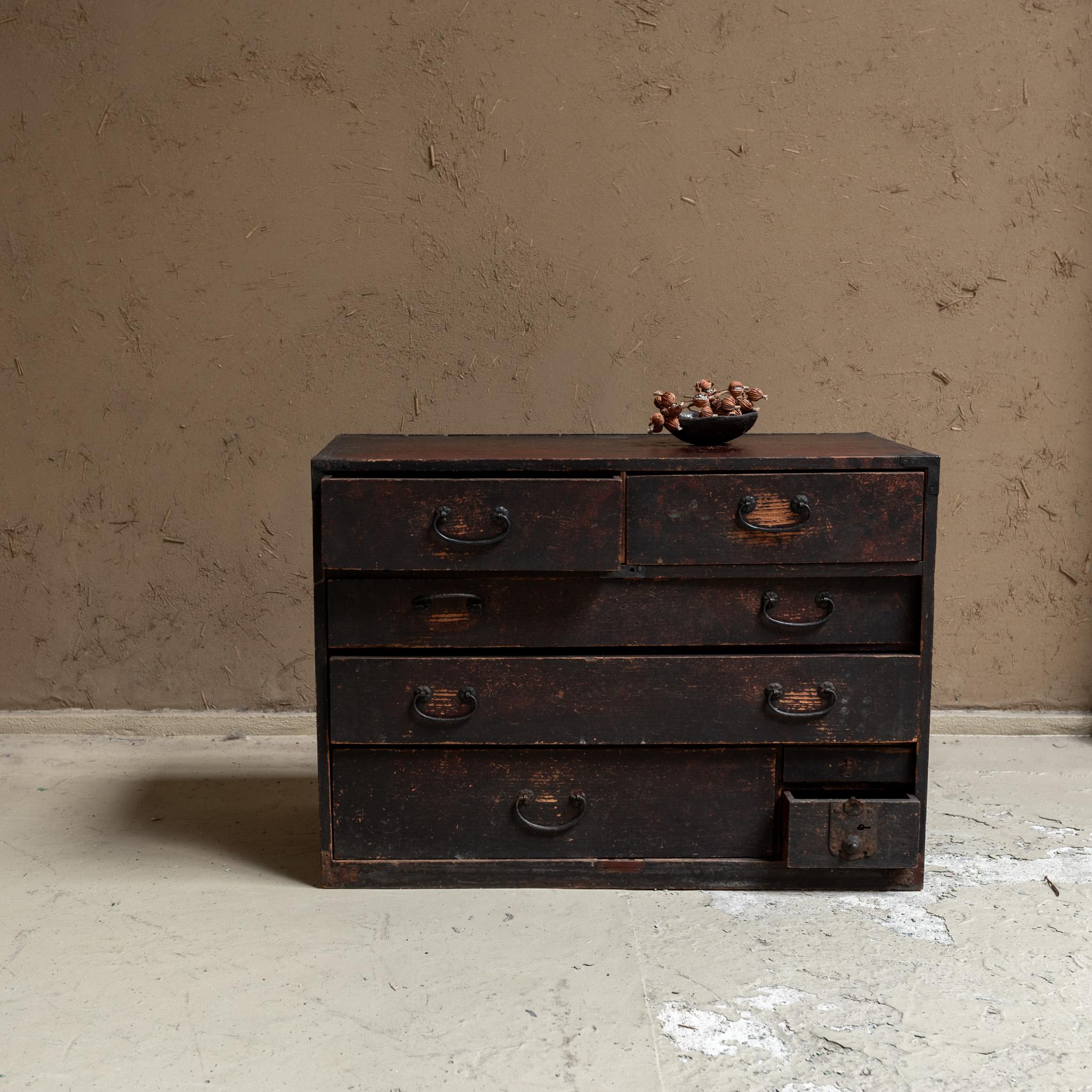  A beautifully crafted antique tansu, piece of functional furniture with deep Japanese roots. This larger tansu features six compartments, making it both a practical storage solution and a work of art. Each section is designed for easy access,
