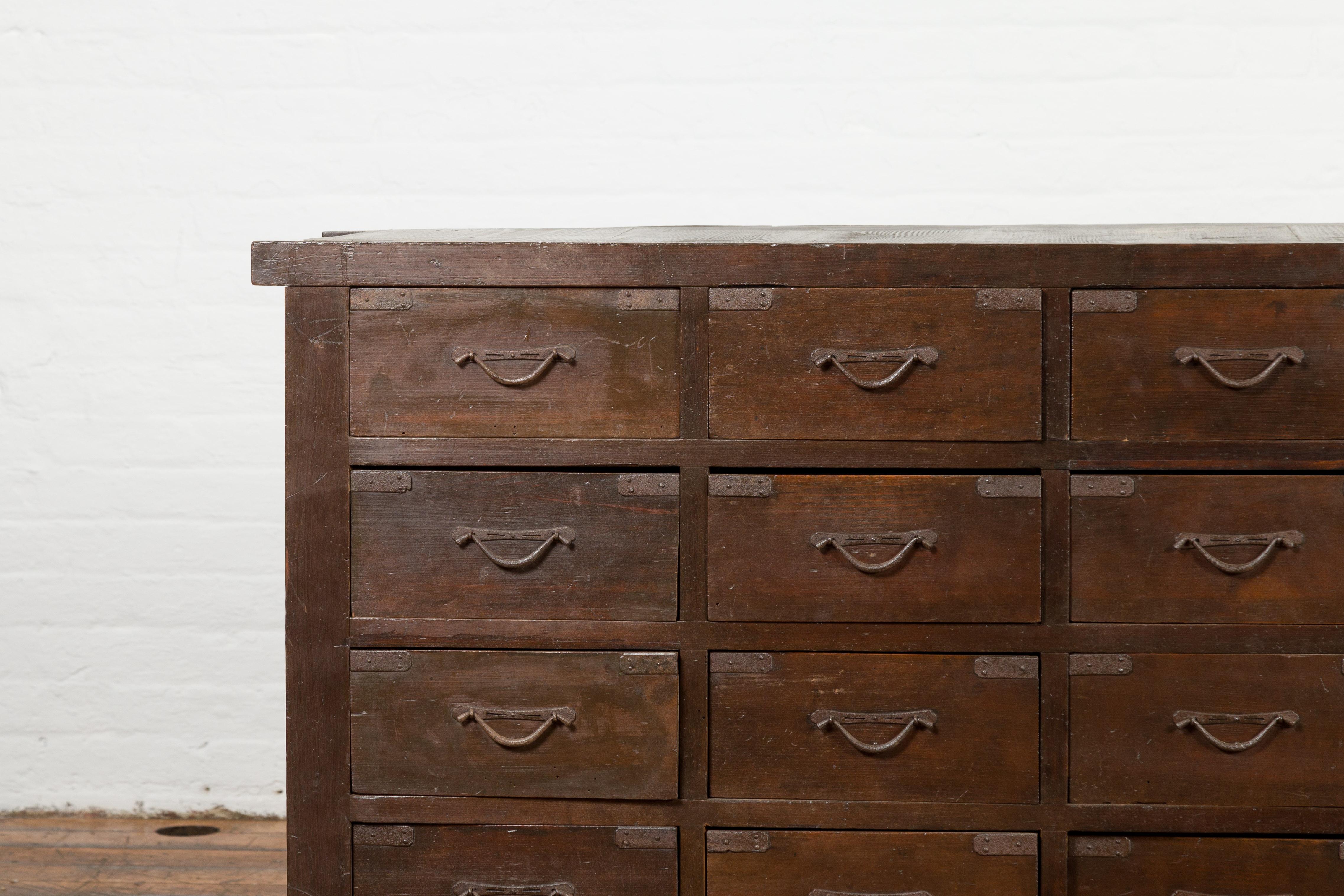 Japanese Early 20th Century Apothecary Chest with 28 Drawers and Brown Patina In Good Condition In Yonkers, NY