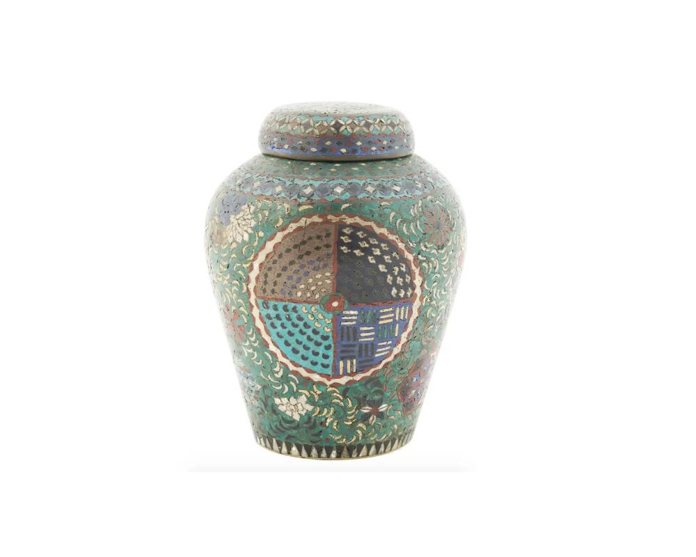 An antique Japanese copper jar with lid. Early Meiji period, mid 19th-century. The item is richly decorated with geometrical cloisonne enamel ornaments against the turquoise background. Collectible Oriental Decor For Interior Design.

Dimensions: H
