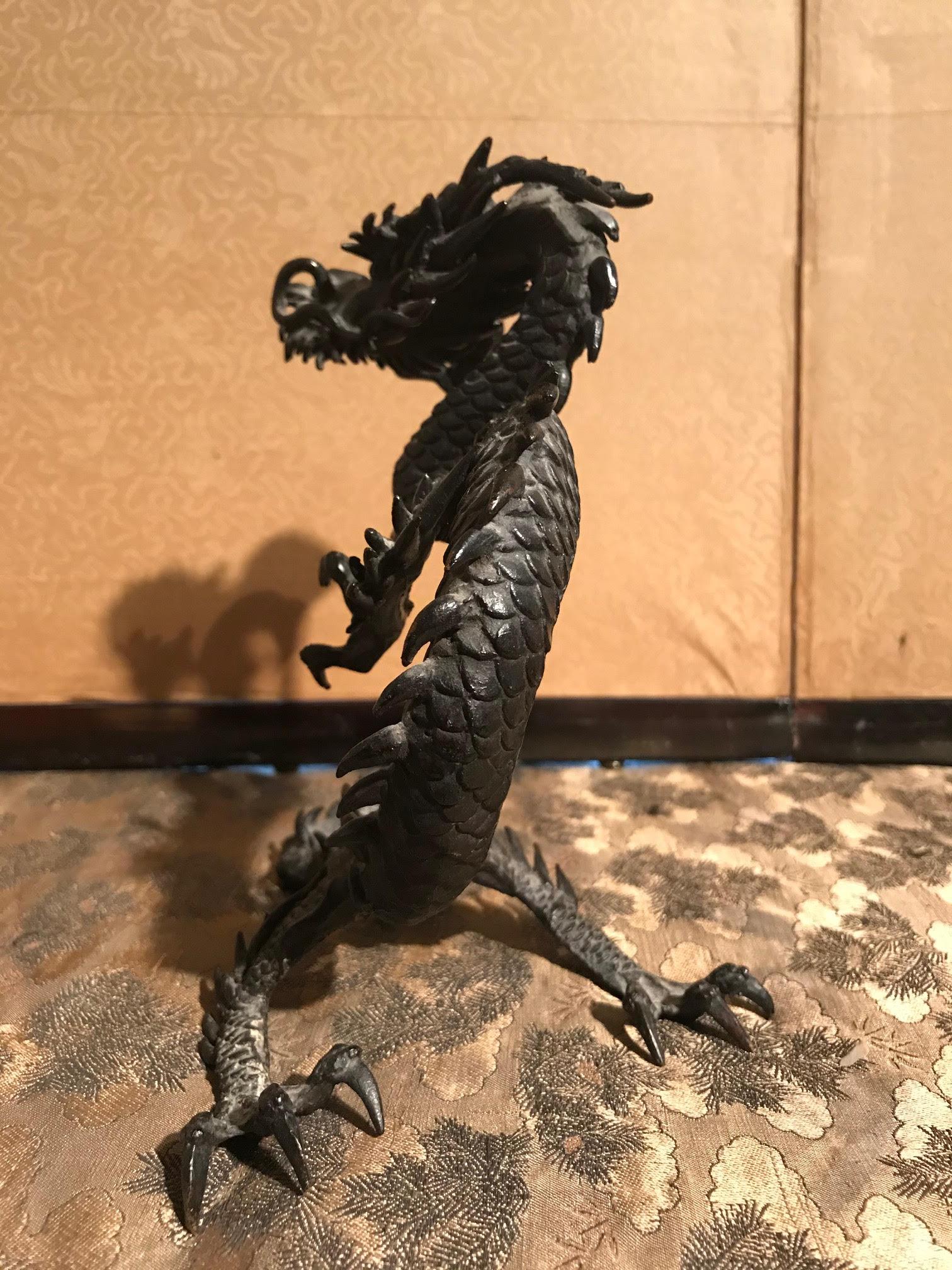 dragon holding orb