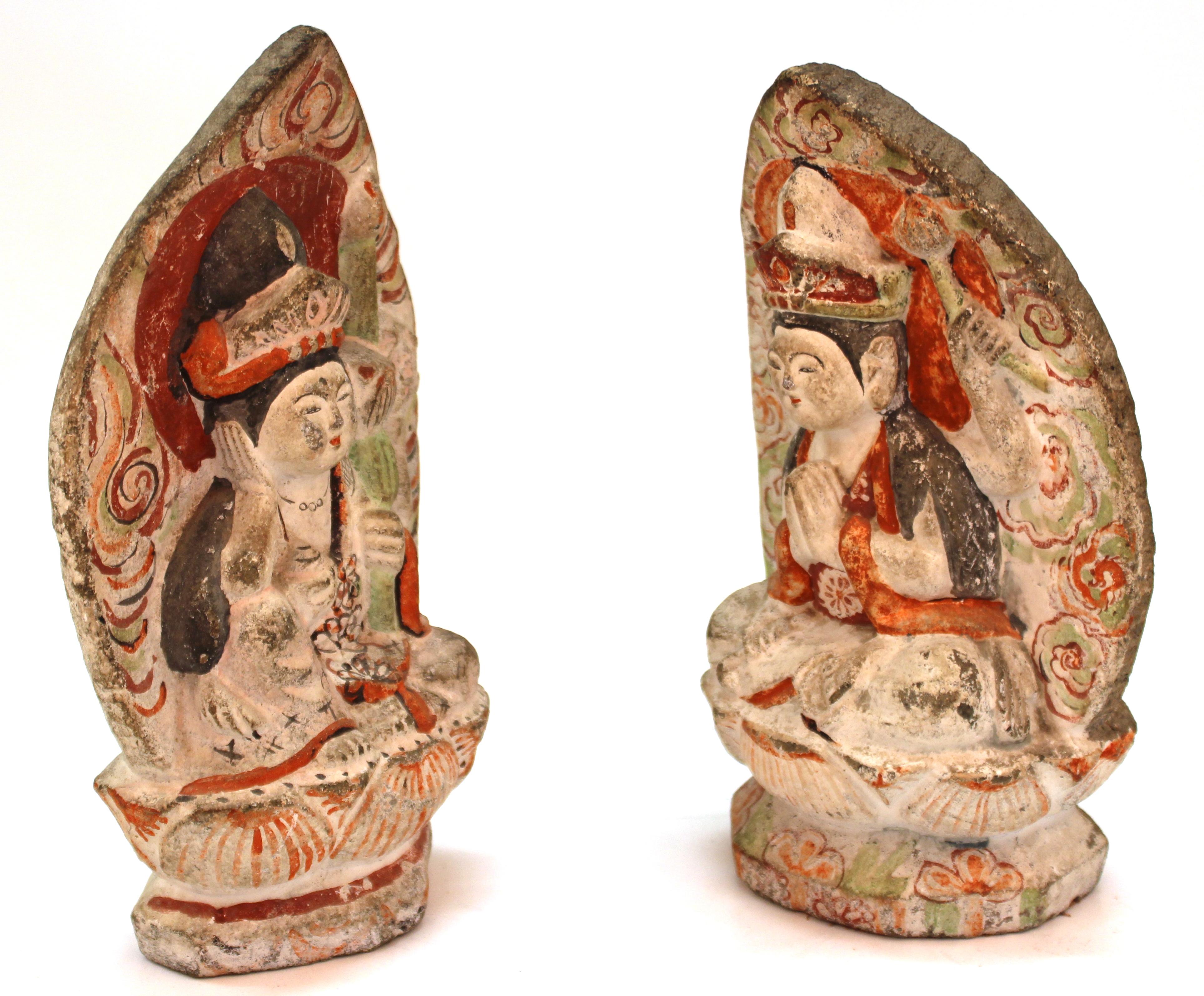 Japanese Edo period pair of carved stone female Bodhisattva sculptures, hand painted. The pair has incised markings on their backs and was made in circa 1750 in Japan. In great antique condition with age-appropriate wear to the material and paint.