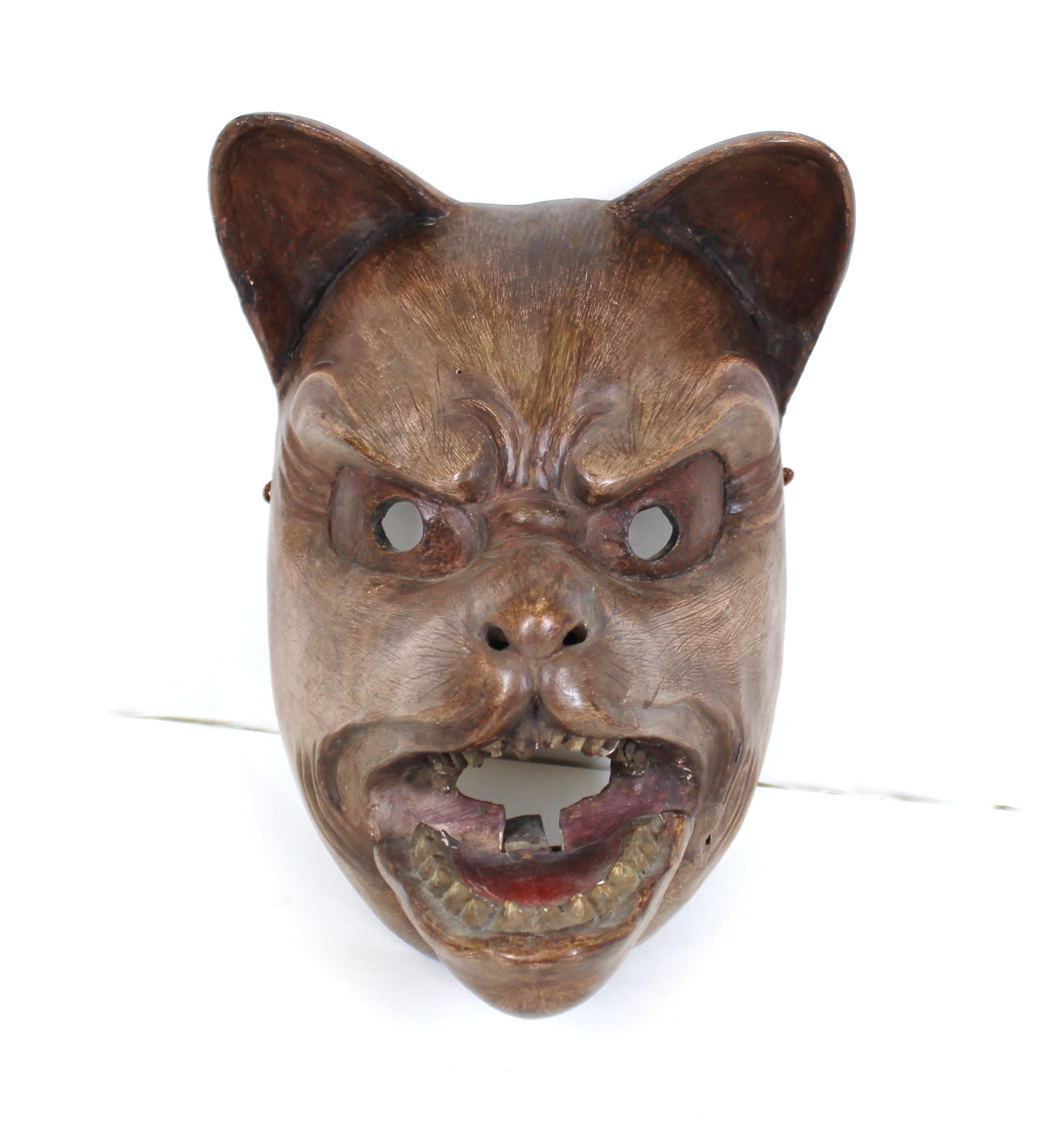 Japanese Edo period carved wood theatrical animal mask of a fox, with articulated jaw. The piece has a detailed expressive face and was carved during the early 18th century, circa 1720. In remarkable antique condition with age-appropriate wear and