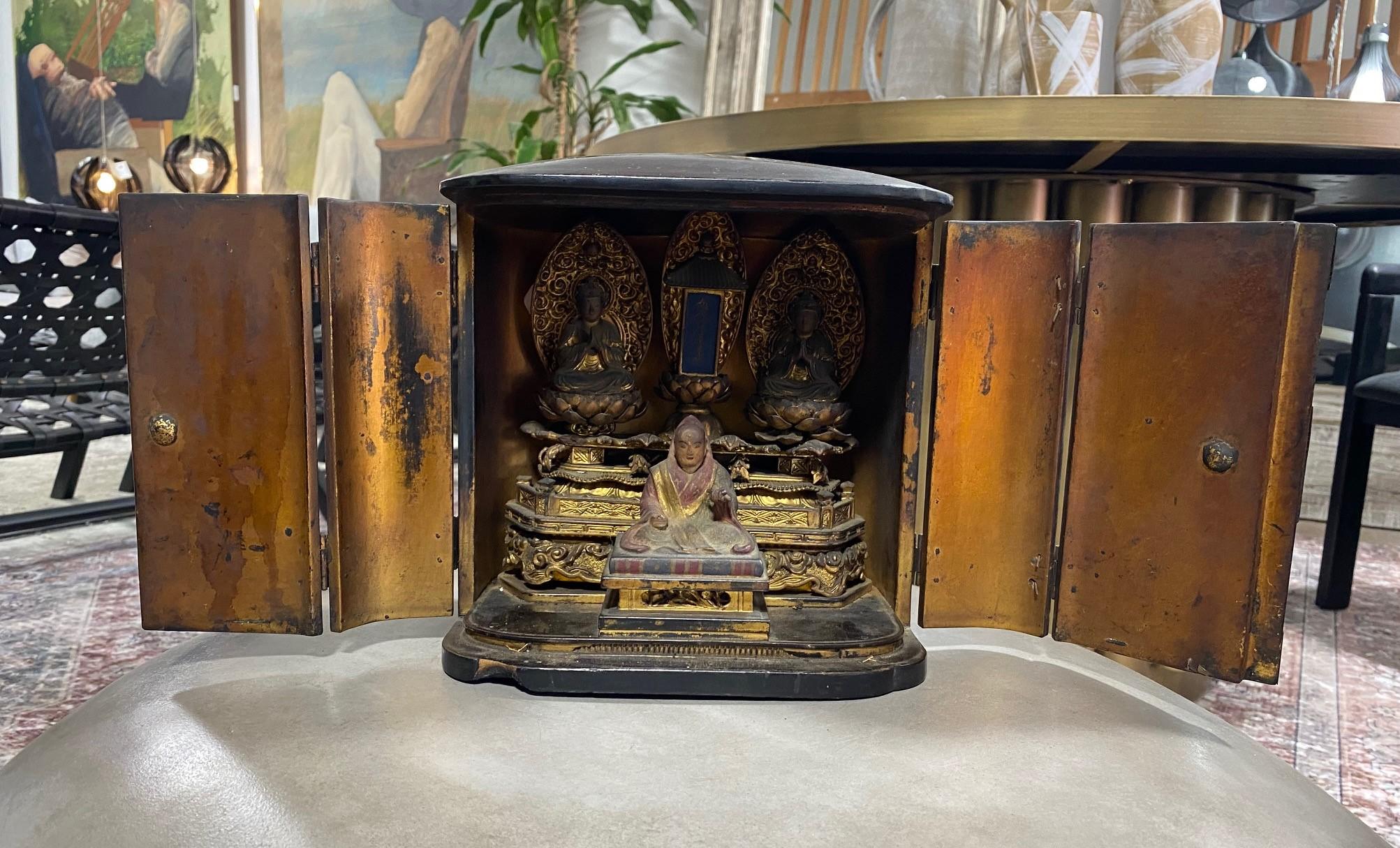 A gorgeously designed and ornamented, well-crafted Japanese Nichiren Shu Buddhist traveling Zushi Buddha shrine. Per our Japanese friend, to the left is Shaka Nyorai (Shakamunibutsu) and on the right, is Taho Nyorai. In the middle is the Treasure