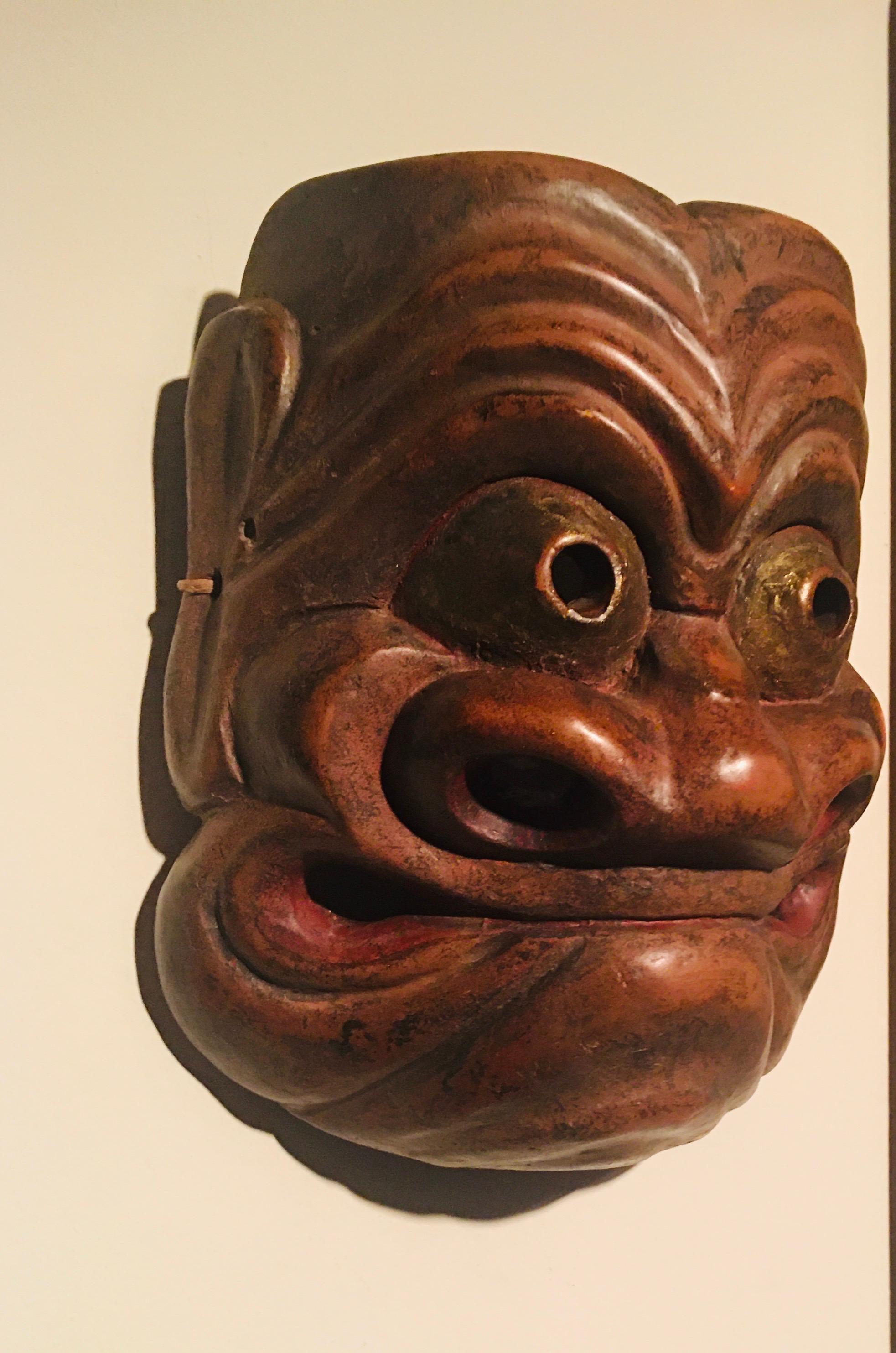 Japanese Edo period carved, lacquered and gilt cypress wood Noh mask of Obeshimi. Made in the circa late 17th century, this extremely rare piece represents the oldest form of beshimi masks, characteristically where the mouth is firmly clenched and