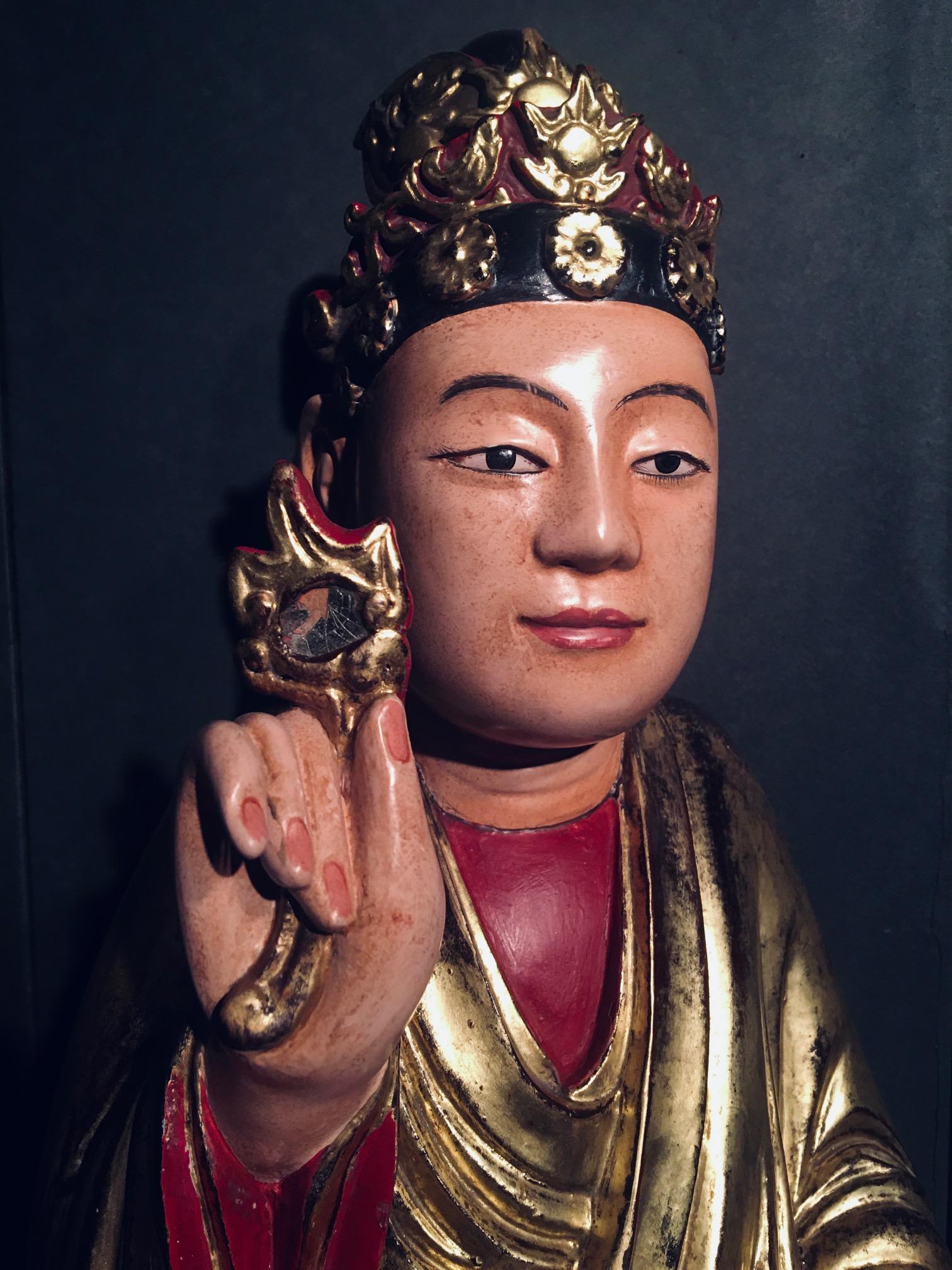 buddha holding flower