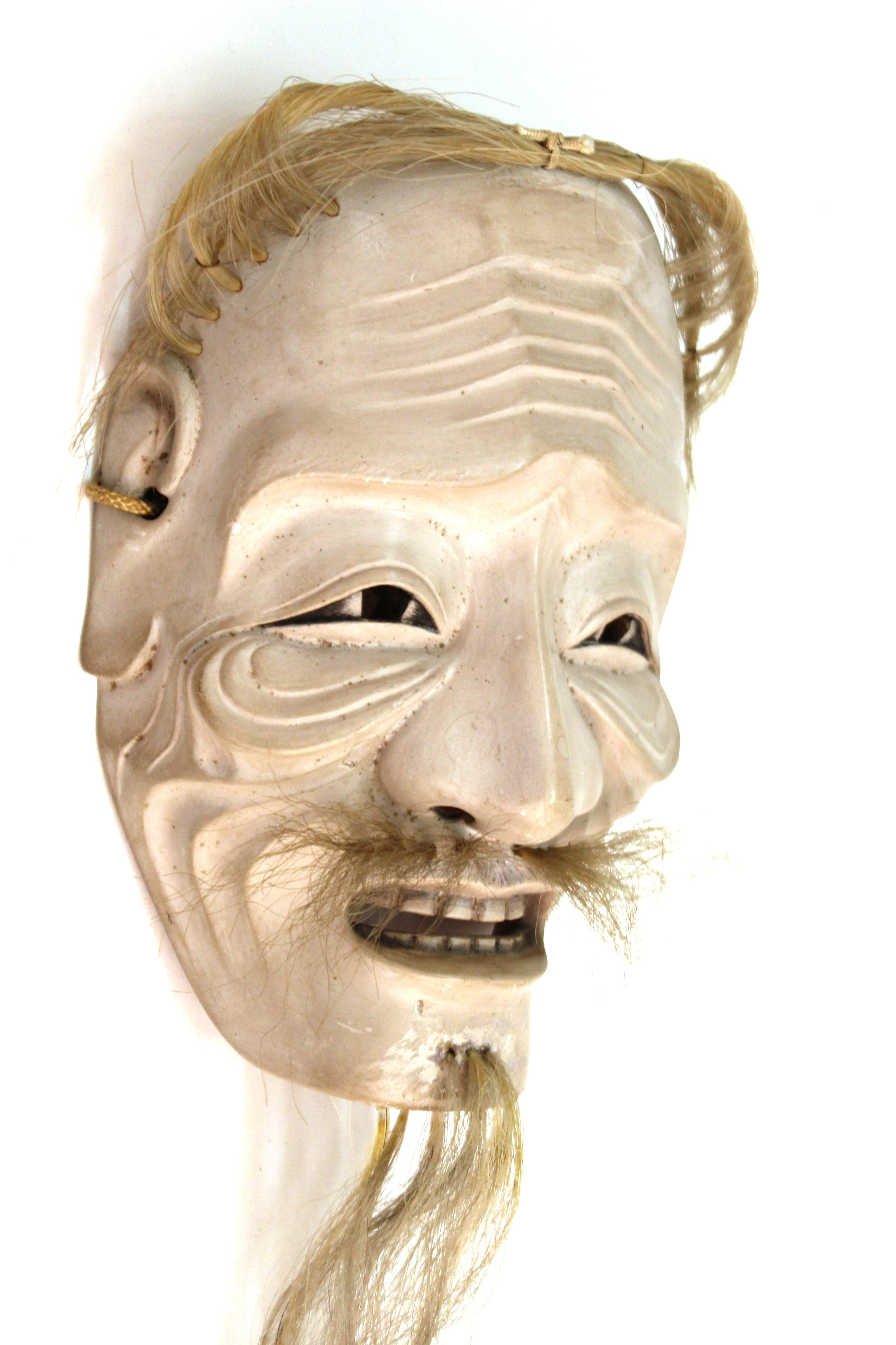 Japanese Edo period carved wood mask depicting Ko-Jo, an old man. The piece dates to circa 1820 and is in great condition. 15 inches long with the beard.