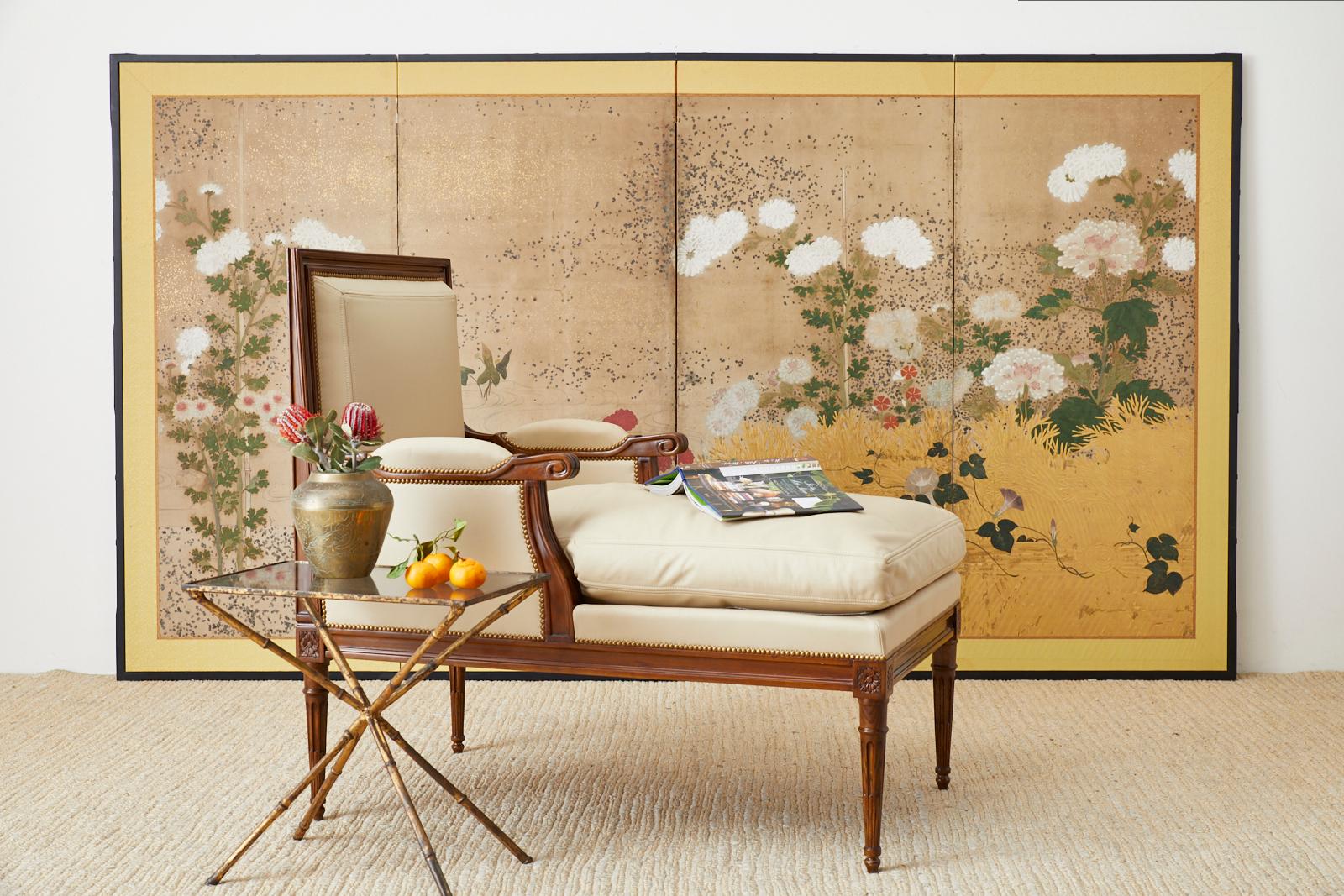 Stunning Japanese Edo-period four-panel screen depicting a meandering stream bordered by a brushwood fence with numerous floral blossoms. Beautifully made with moriage raised white flowers and a moriage gilt fence. The screen features