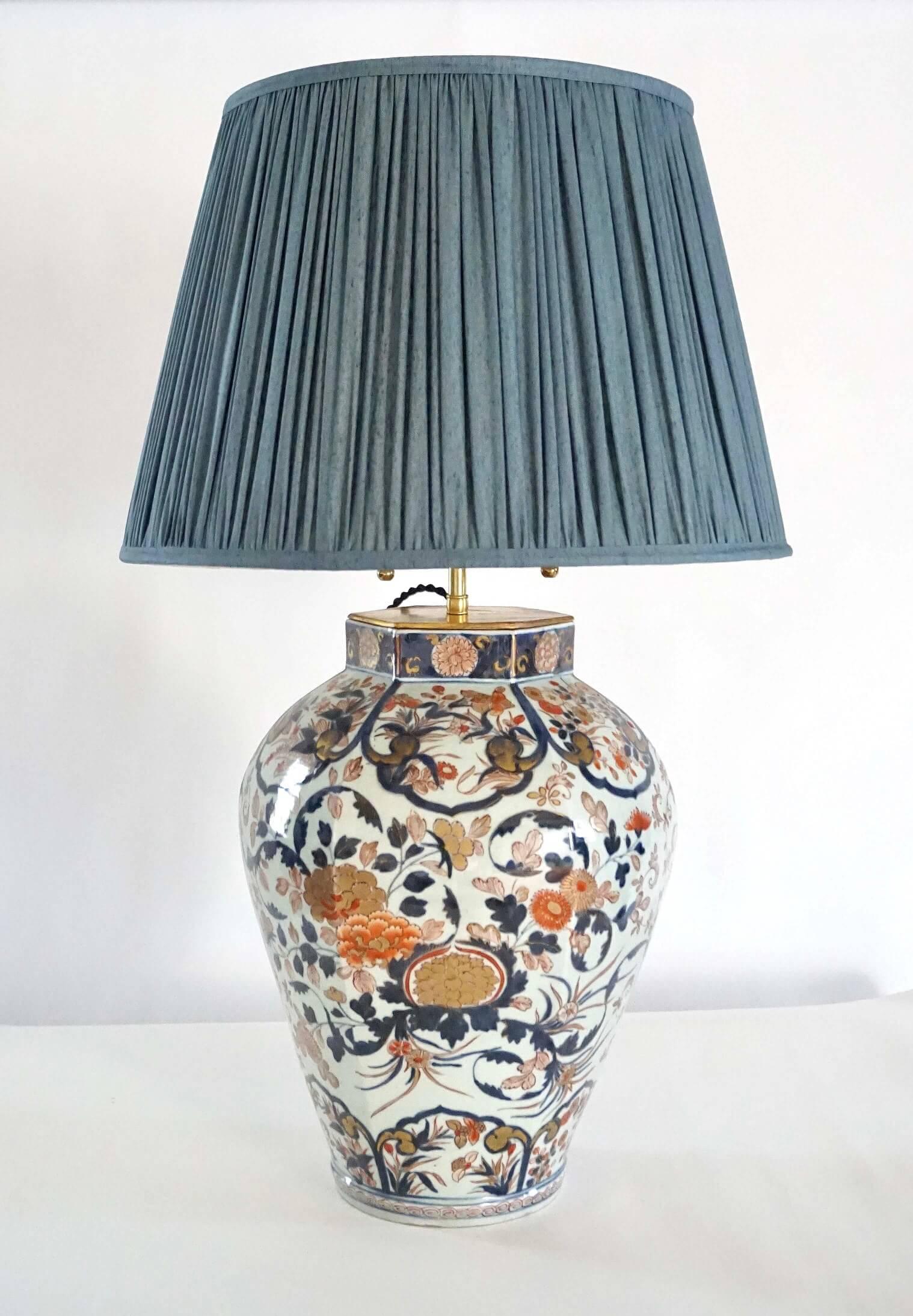A late 17th, early 18th century Japanese Edo period Imari porcelain vase or jar of hexagonal baluster form having underglaze blue and overglaze iron red and gold gilt panel and foliate designs; now fitted for use as a table lamp with a bespoke