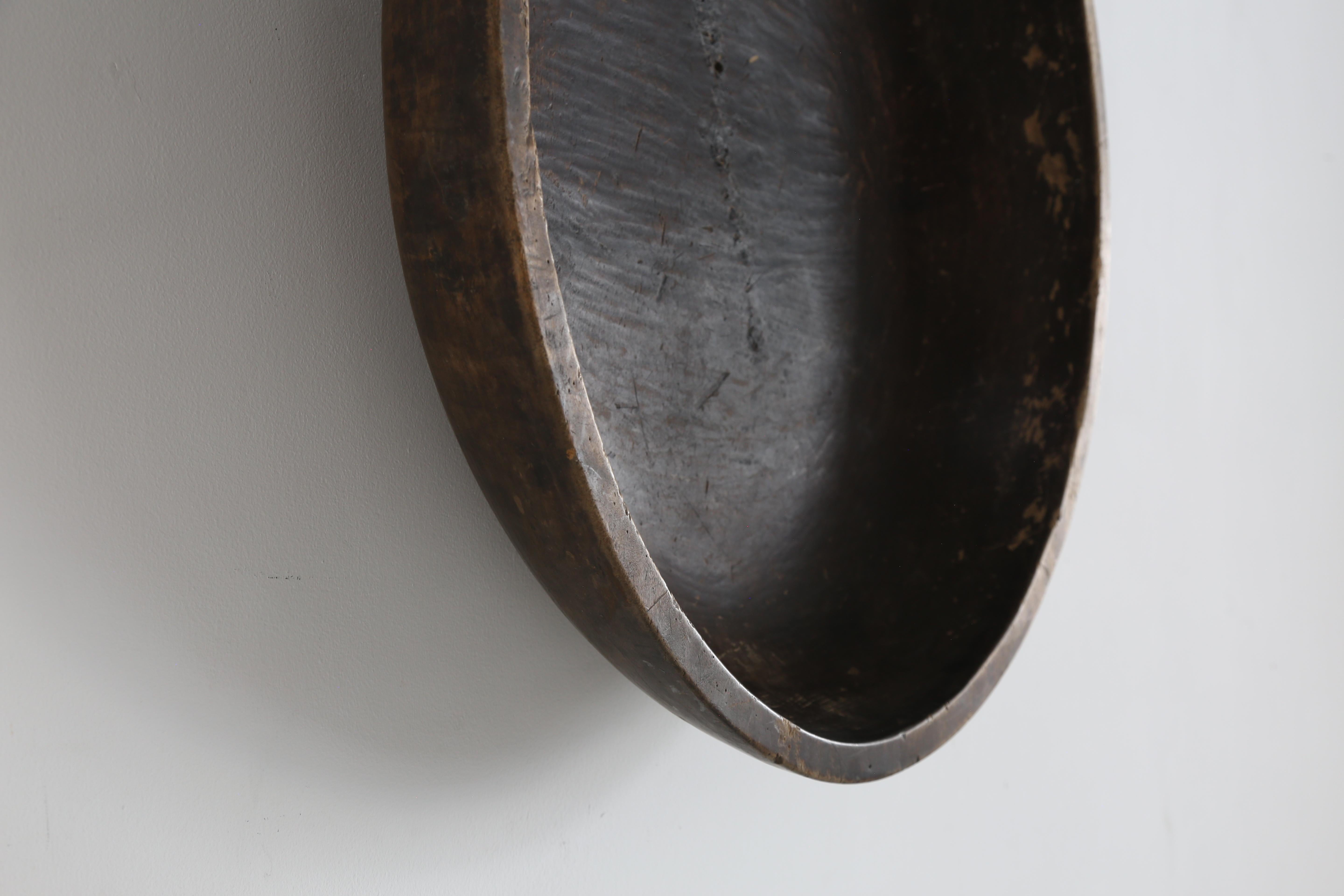 Japanese wabi sabi preparation bowl. 

Monoxyle i.e carved from one solid piece of cedar wood.

Dating from the late Edo period circa 1850s. 

Makes a wondrous wall hanging or table centrepiece.  

L64cm x W61 x D20cm