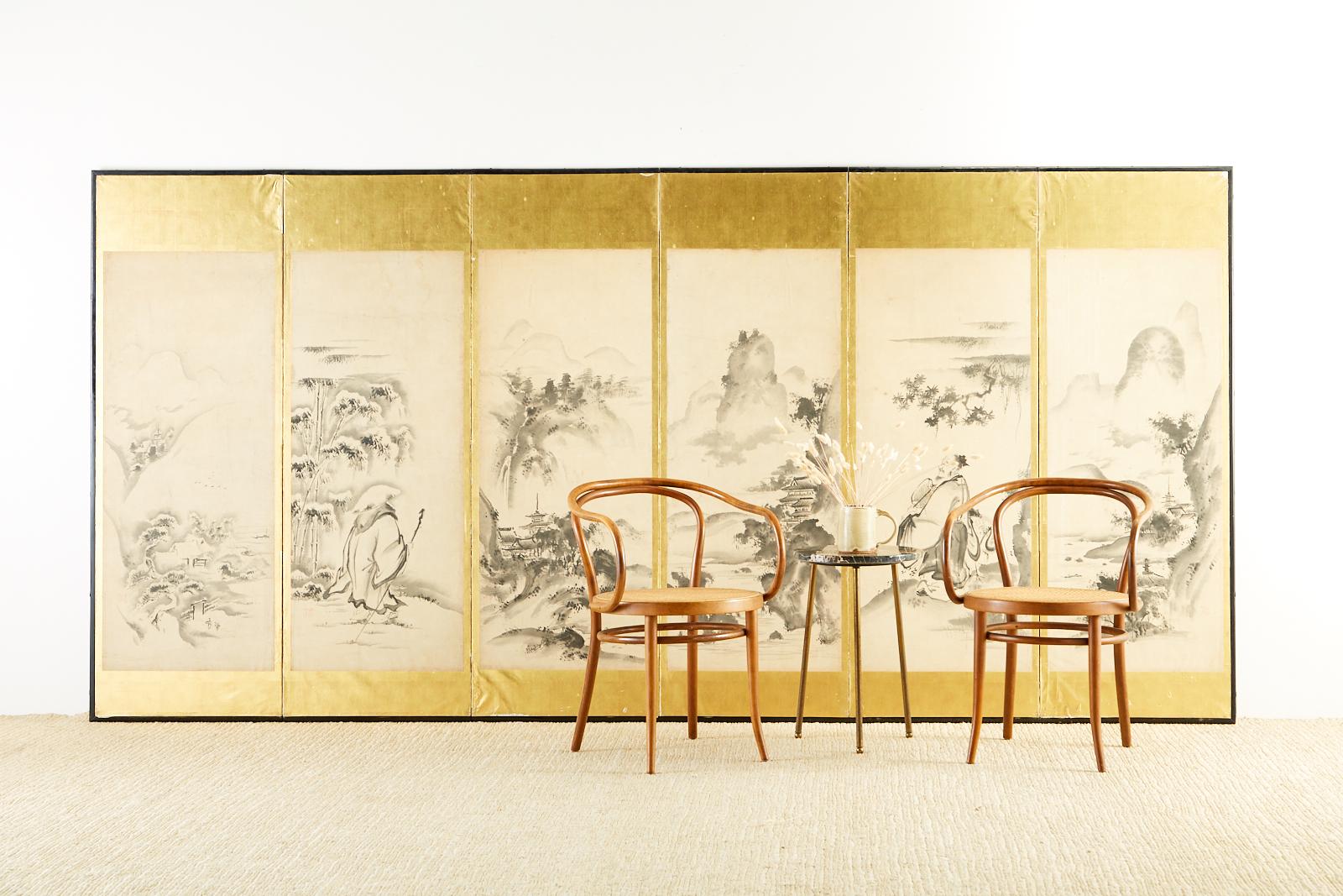 19th century Japanese Edo period six-panel screen painted in Haboku (splashed ink) style. Depicts Four Seasons landscape scenes with two portraits of Chinese sages. One sage is traveling in the snow, the other is with a crane. Kano school ink on