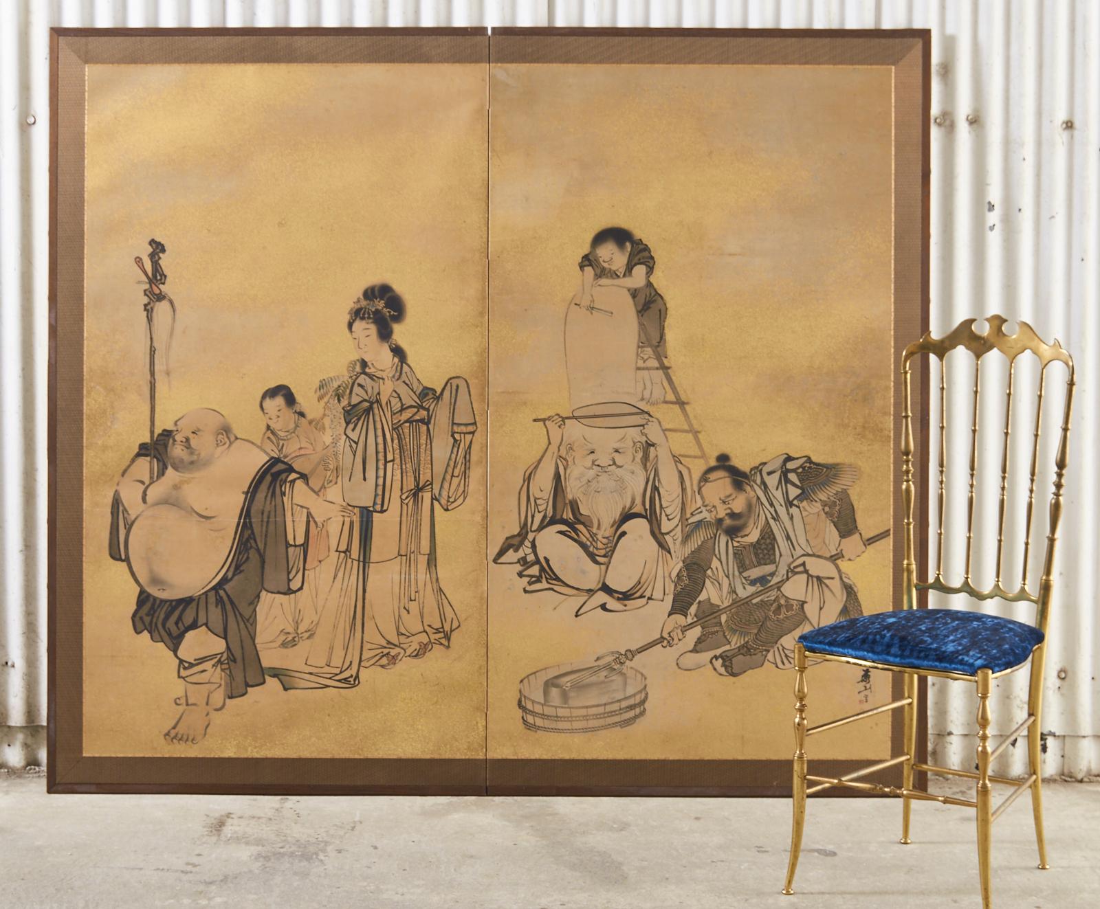 Whimsical Japanese late Edo period two-panel screen circa 1800 by Yokoyama Kazan (Japanese 1784-1837). The screen depicts four of the seven Gods or deities of good fortune. Hotei, Benten, Fukurokuju, and Bishamonten. Maruyama-Shijo School ink and