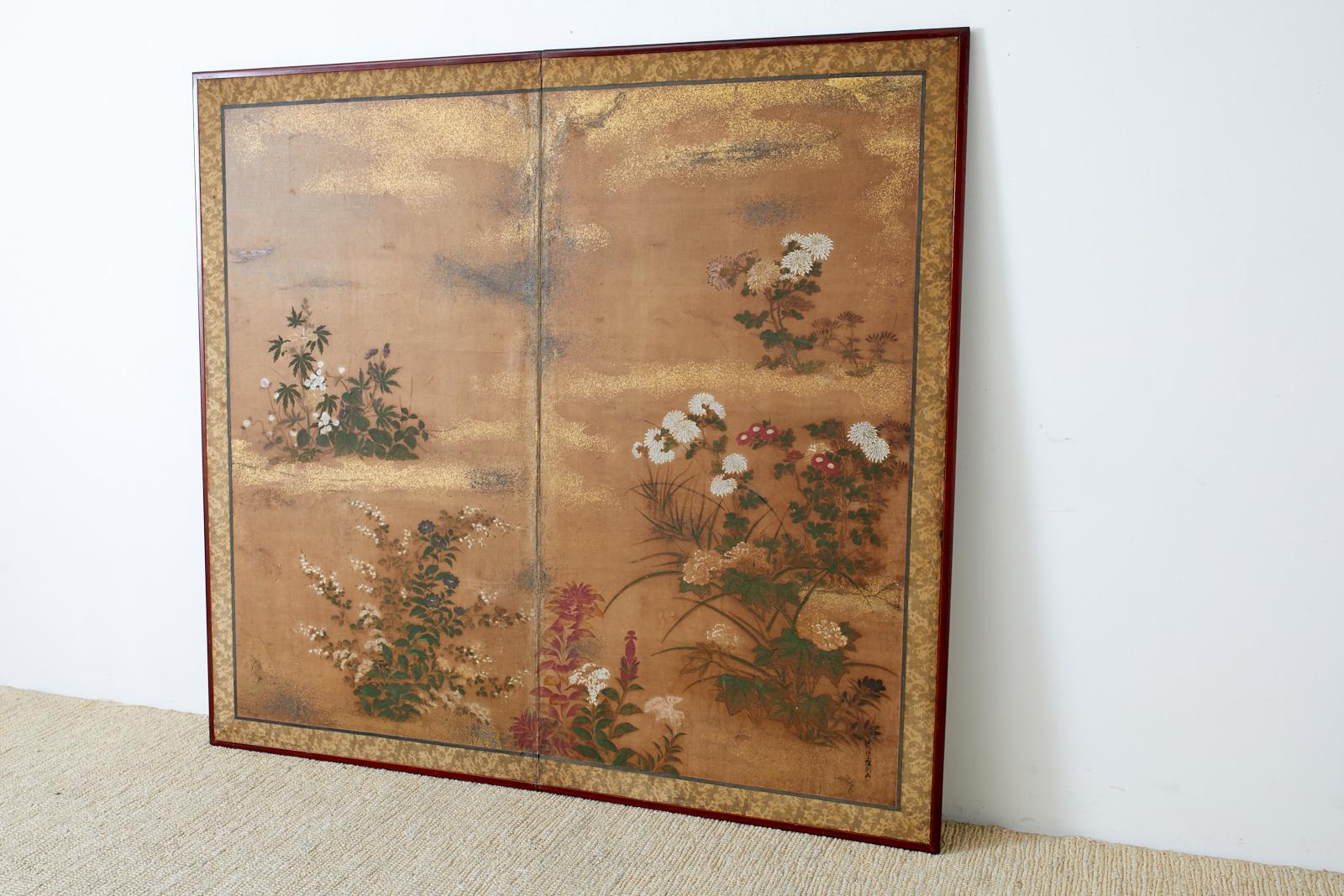 Impressive early 19th century Japanese Edo period two-panel screen featuring flowering plants and grasses of autumn. Painted in the Tosa School style Bunka Bunsei period or Ogosho period (1804-1829) signed Juroki-i-jo (upper junior sixth rank)