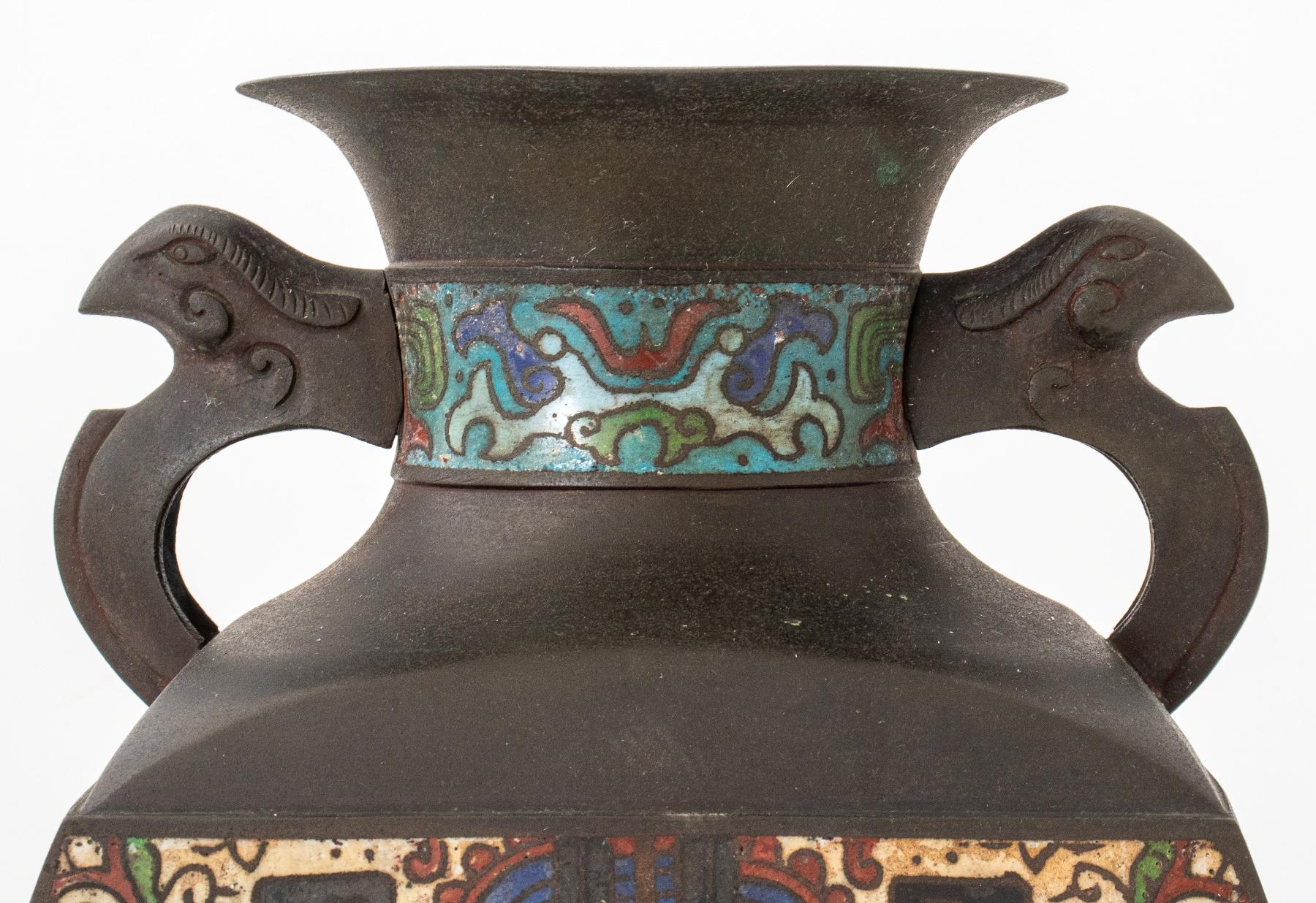 Japanese cloisonne enameled bronze vase in the Chinese style with four sides, and rabbit handles, the sides enameled in imitation of Shang period examples.

Dimensions: 14.25