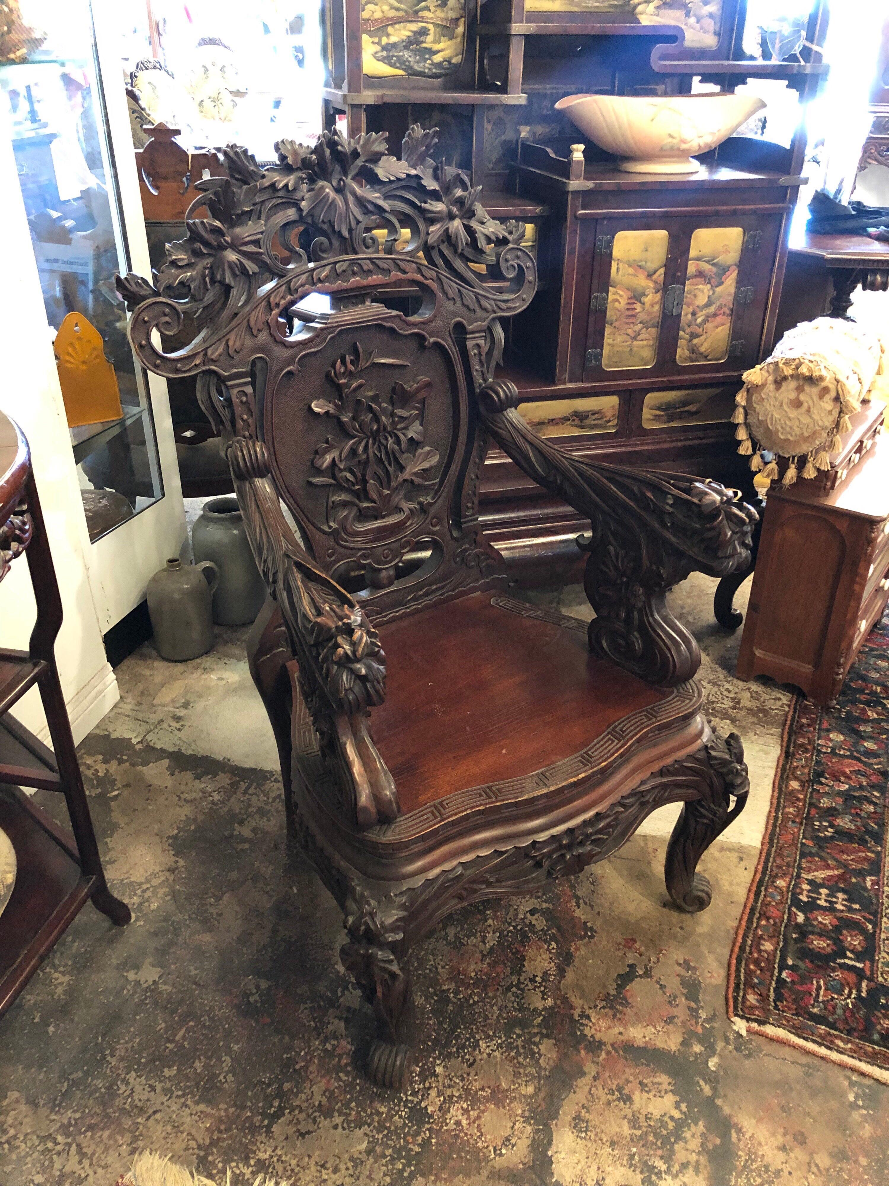Japanese Export Highly Carved Dragon Themed Chair.
Having a large carved dragon on the back area with dragon handles and an etching of waves on the seat. 