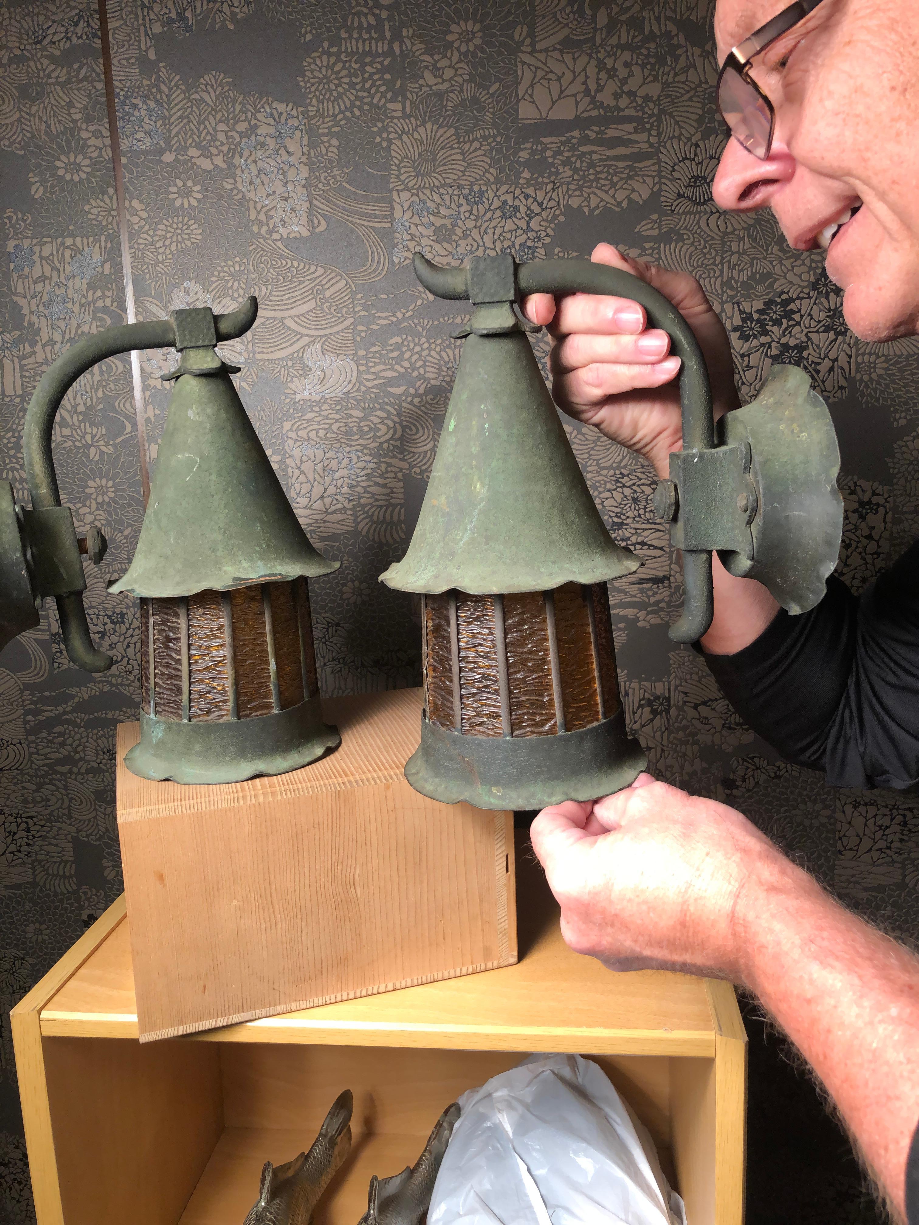 Japan, a handsome high quality pair of large bronze light fixtures and sconces  with their original amber glass and wall mounting hardware in tact, circa 1920s.

Superb originl green patina

Dimensions: 11.5 inches tall and 10 inches wide and