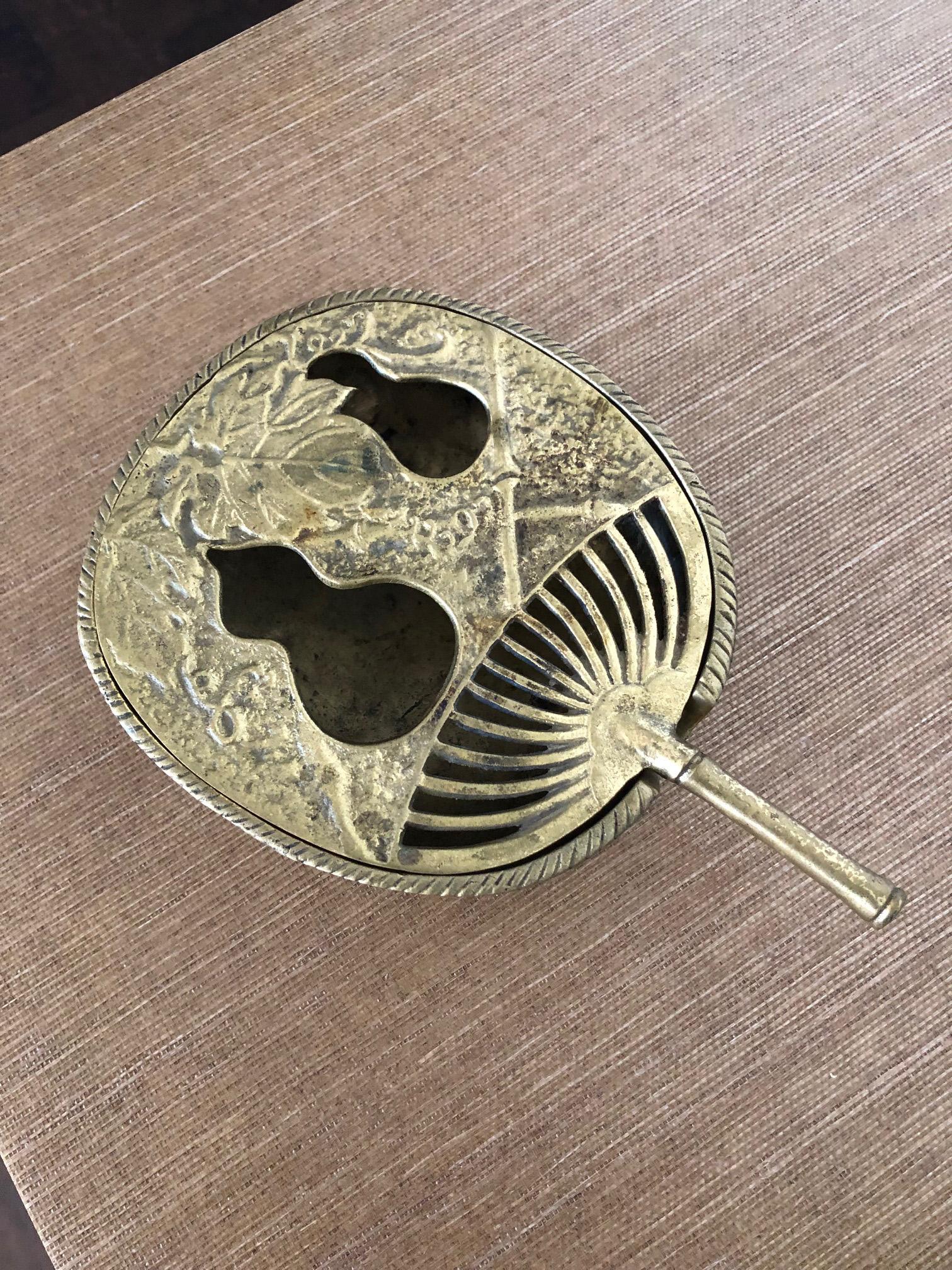Beautiful solid brass incense burner in the shape of a fan, marked Japan.