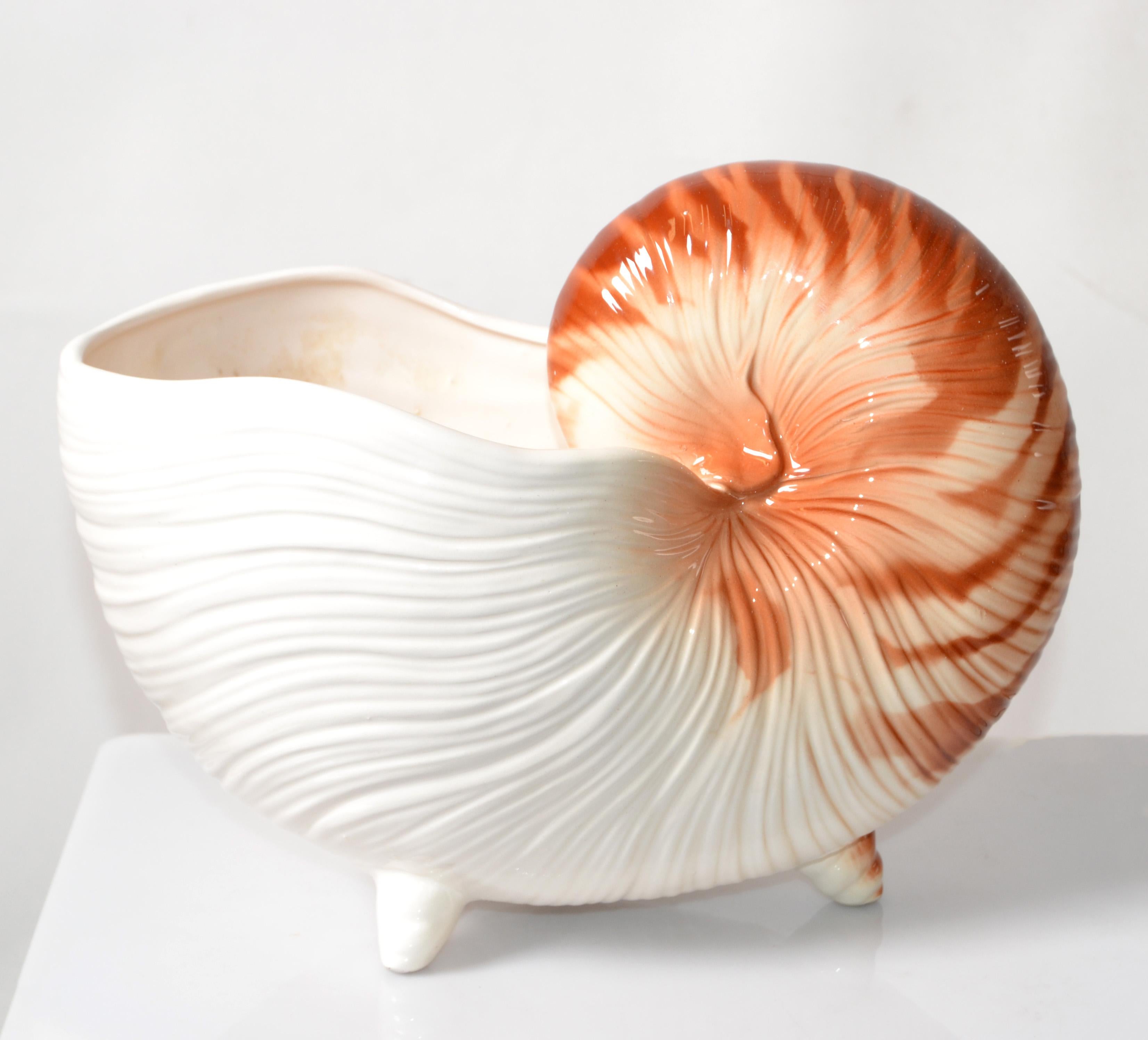 Hollywood Regency vintage hand painted Nautilus ceramic planter, footed Bowl, Centerpiece or Nautical Animal Sculpture.
Made in Japan in circa 1980.
The original FF Japan Label is attached at the Base.
In very good condition with no visible signs