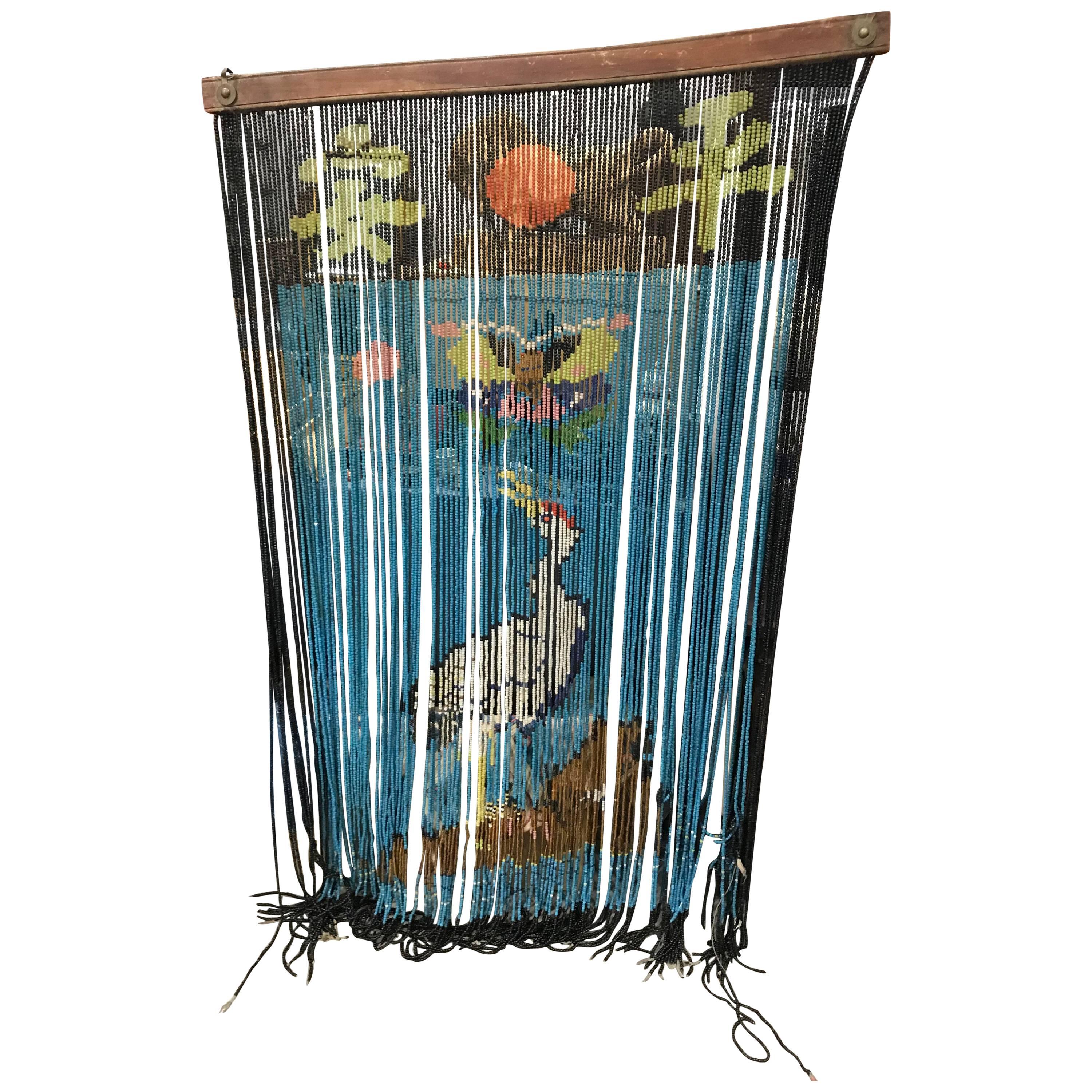 An exceptional one-of-a-kind find.

Featuring the  kanji -Peace- symbols with auspicious symbols sun and long life crane

This fine quality 100+ year old Japanese handcrafted glass beads curtain or noren (entry way curtain) is hand assembled from