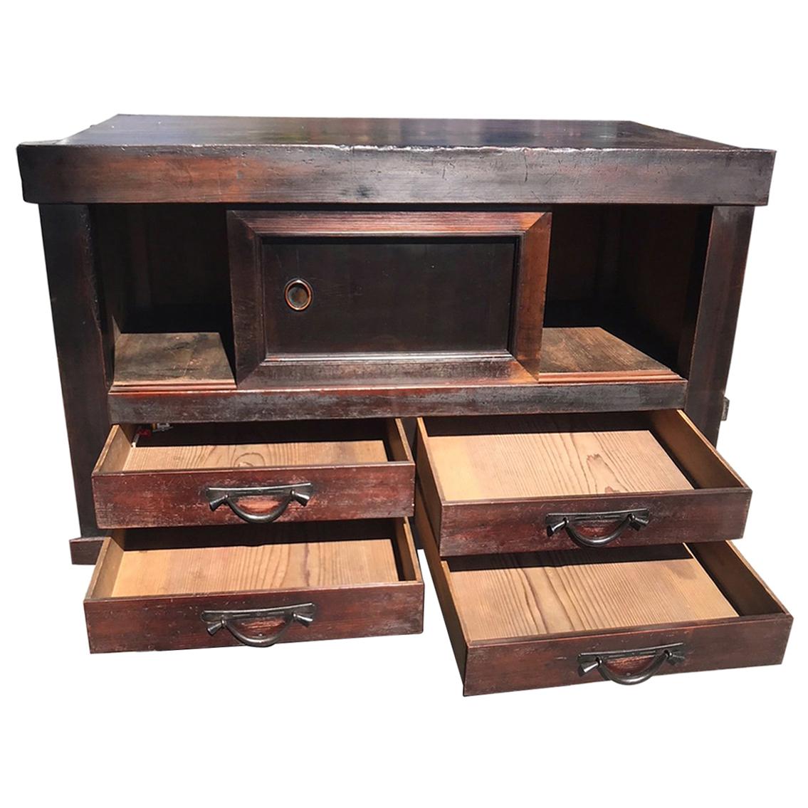 From our recent Japanese Acquisitions travels.

This is a hard to find antique smaller tansu storage chest/cabinet hand crafted with beautifully selected grained wood and fine lines and a multitude of storage features and options. It is in