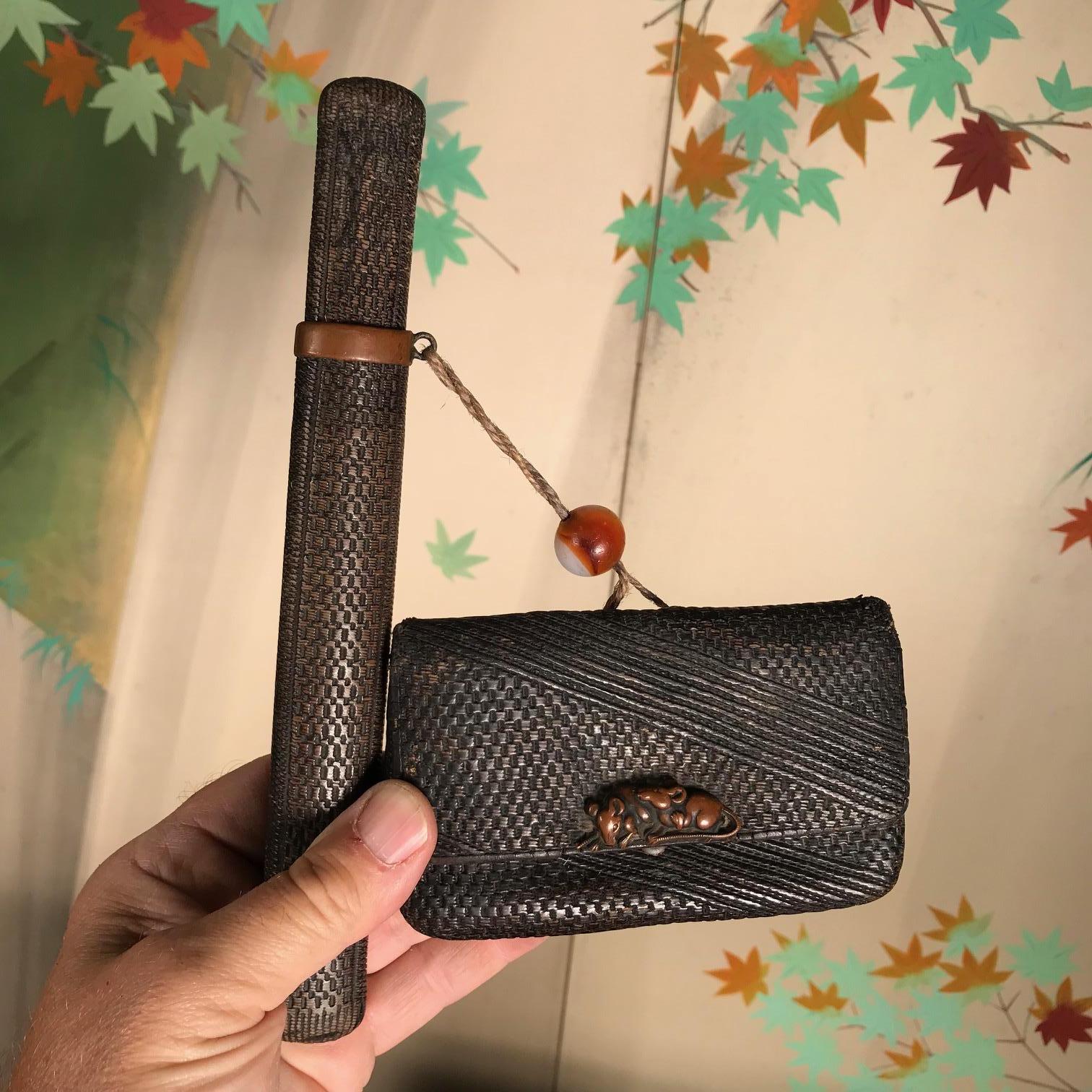 Another collection find from our most recent Japanese acquisitions trip.

Unusual Mice Find!

This is a complete set foursome of Japanese antiques including and original kiseru pipe, its leather cover/ slip box, a leather pouch with a metal