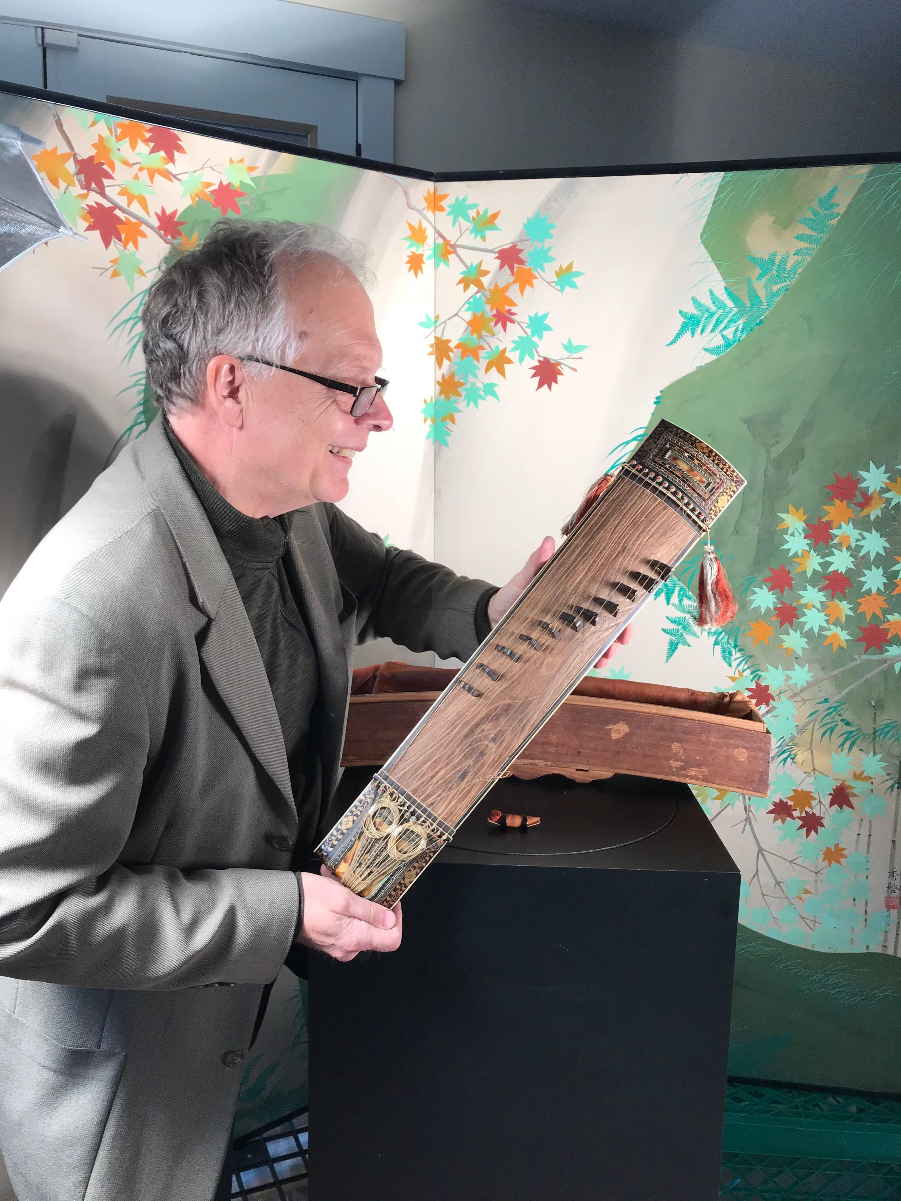 From our recent Japanese acquisitions trip.

Japan fine antique lacquered Maki-e Koto Lute stringed instrument, in a rare violin size, Meiji period 19th century. Includes original wooden storage box and yellow protective cloth. Immediately