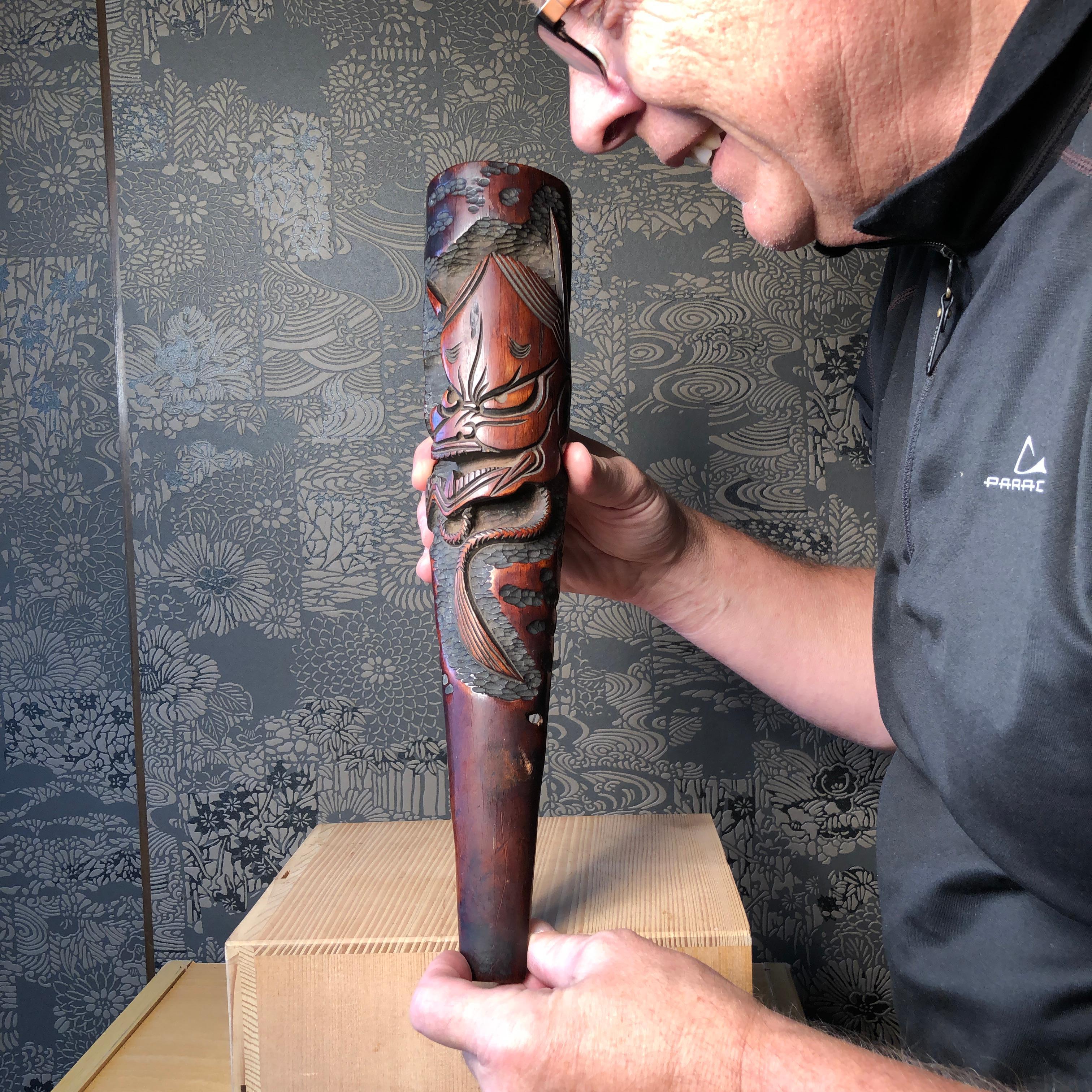 Rare find from our most recent Japanese acquisitions trip.

This is a unique Japanese large hand carved wood kiseru Yakusa opium or tobacco pipe dated October 12, 1895 and with the owner's name, Koike Sanfuro. 

The massive pipe It features a deeply