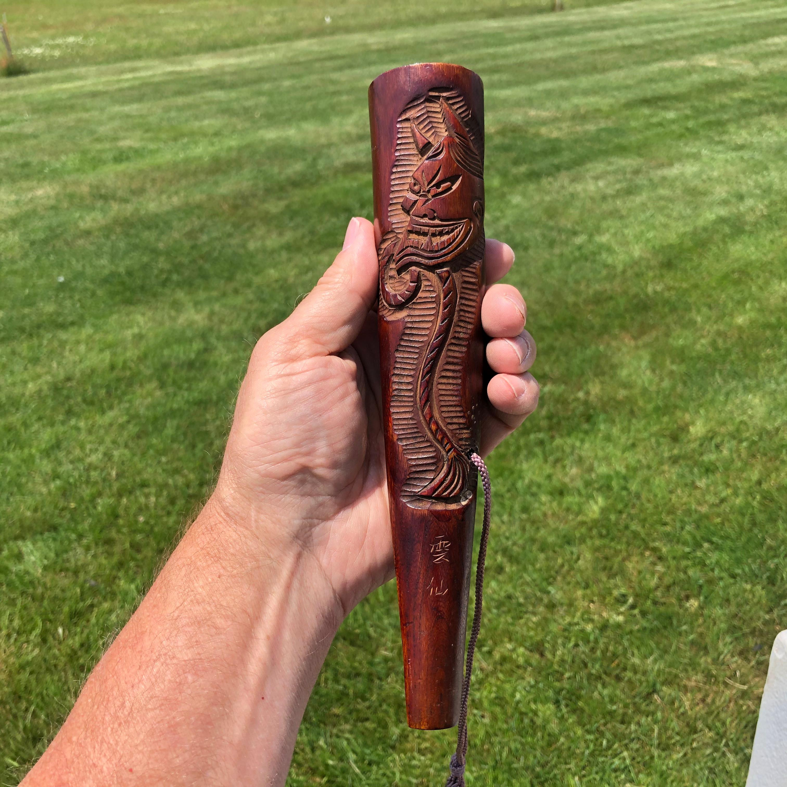 Rare find from our most recent Japanese acquisitions

This is a unique Japanese large hand carved wood kiseru Yakusa opium or tobacco pipe dating to the early 20th century and signed.

The massive pipe features a deeply incised Hanyya demon