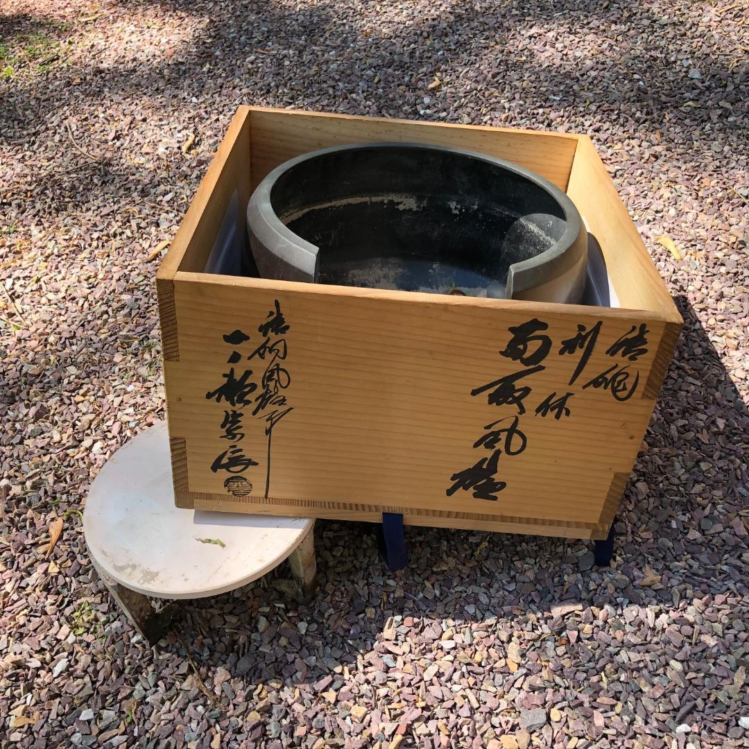 Complete, boxed and signed set

A fine Japanese cast bronze hibachi or brazier which today can also be re purposed into a fine planter. Comes complete with iron stand for tea kettle, plate, and charcoal tongs. Crafted by an artisan metal