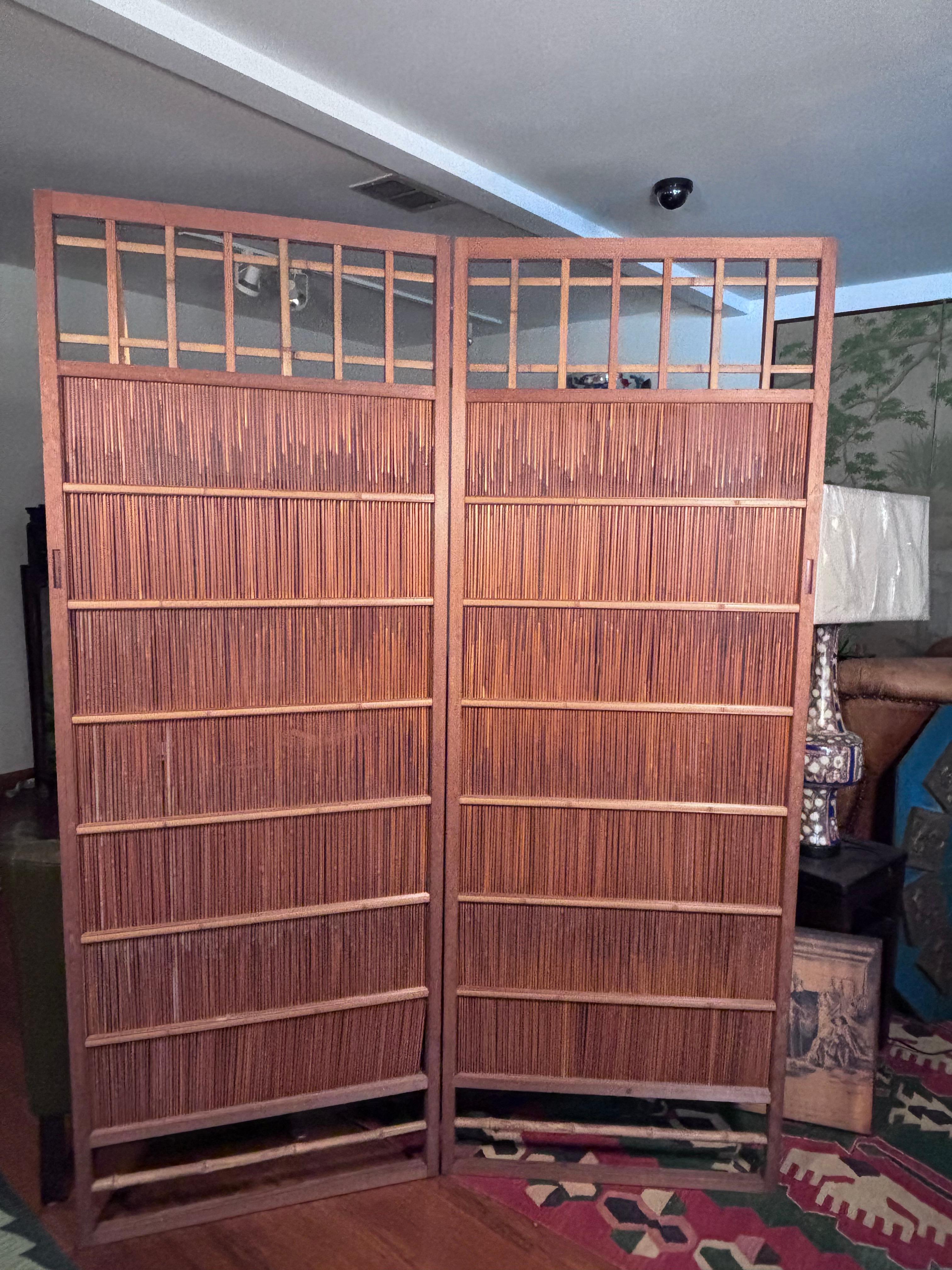 Japan, a fine pair of two simple shoji  bamboo doors or screens creating an arts and crafts look.  The pair are hinged together for convenient display with attractive portals above; however the hinges may be easily removed to create two stand alone